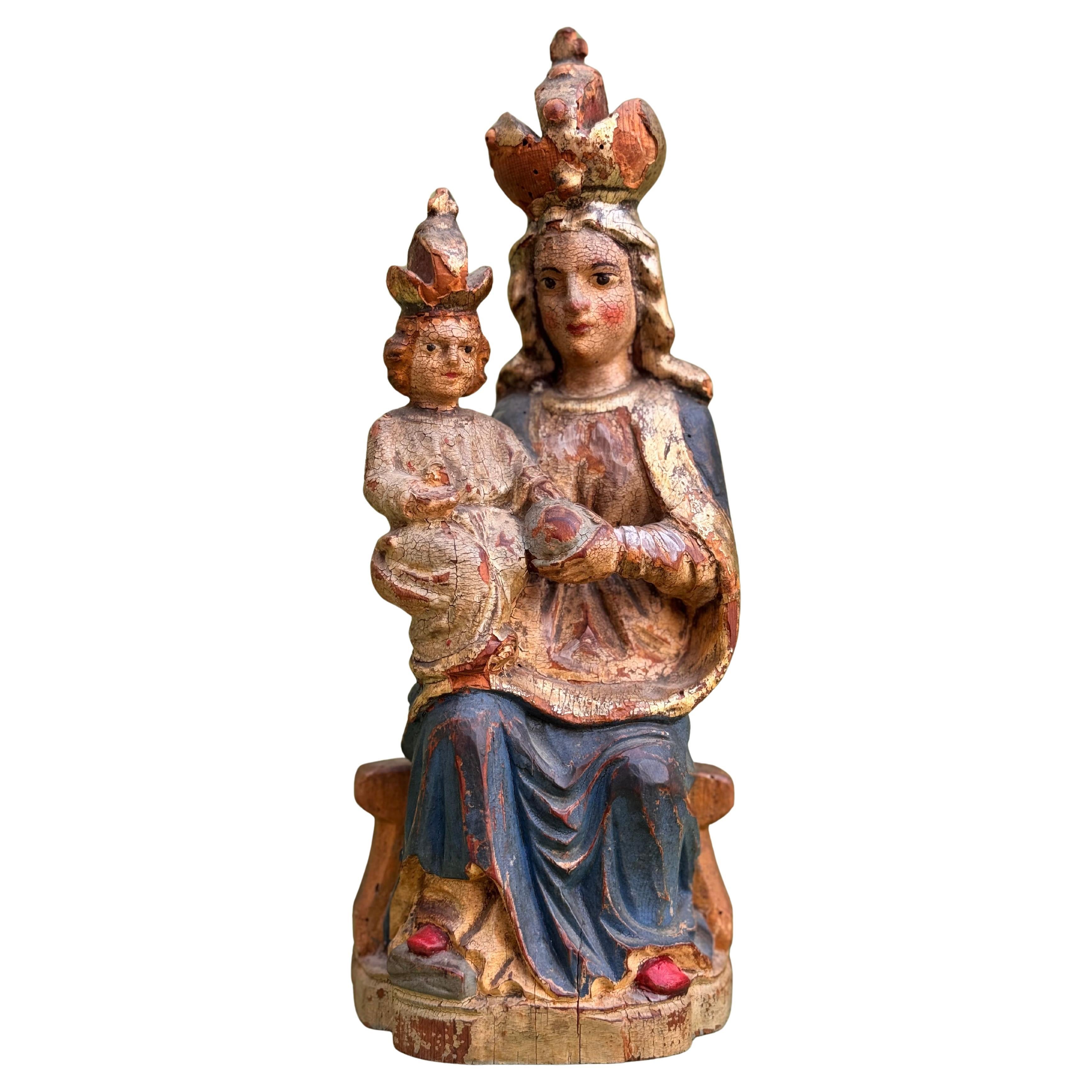 Seated Virgin and Child, both crowned, polychrome wood carving, Spanish school