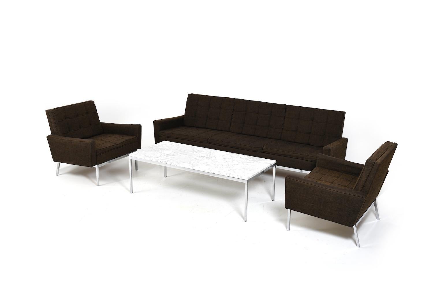 Seating group, model 67A, by Florence Knoll for Knoll Sofa. The seating group consists of a 3-seater sofa, 2 easychairs and a rectangular coffee table with a marble top. The sofa and armchairs are still upholstered in the original brown/black wool