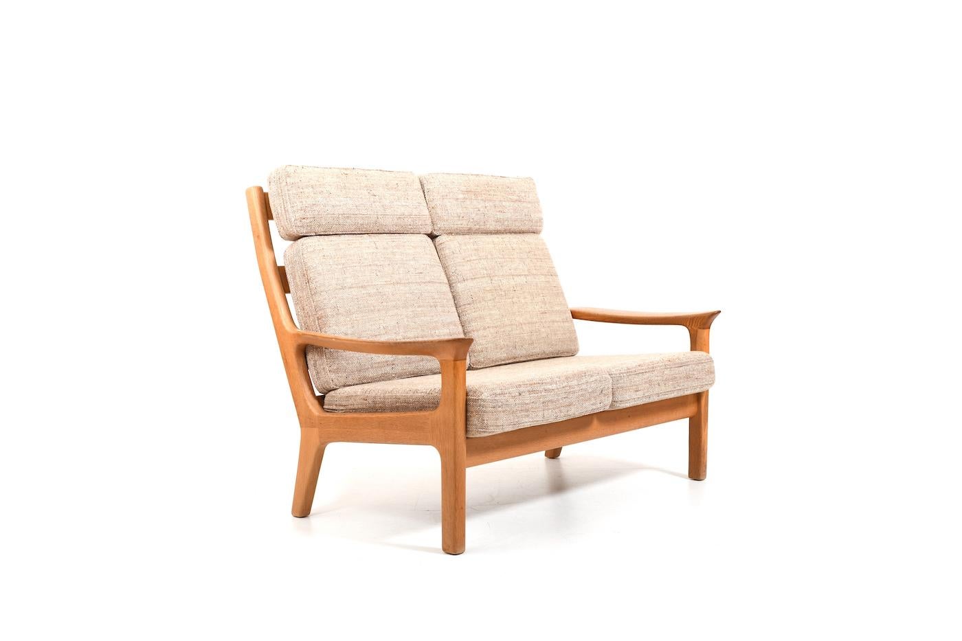 High back sofa set 3-2-1 by Jens-Juul Kristensen for JK Denmark. Made in solid oak. Set consisting of a 3 seater sofa, 2 seater sofa and a lounge chair incl. ottoman. With orig. cushion in creme wool fabric. Denmark, early 1970s. Price for the whole