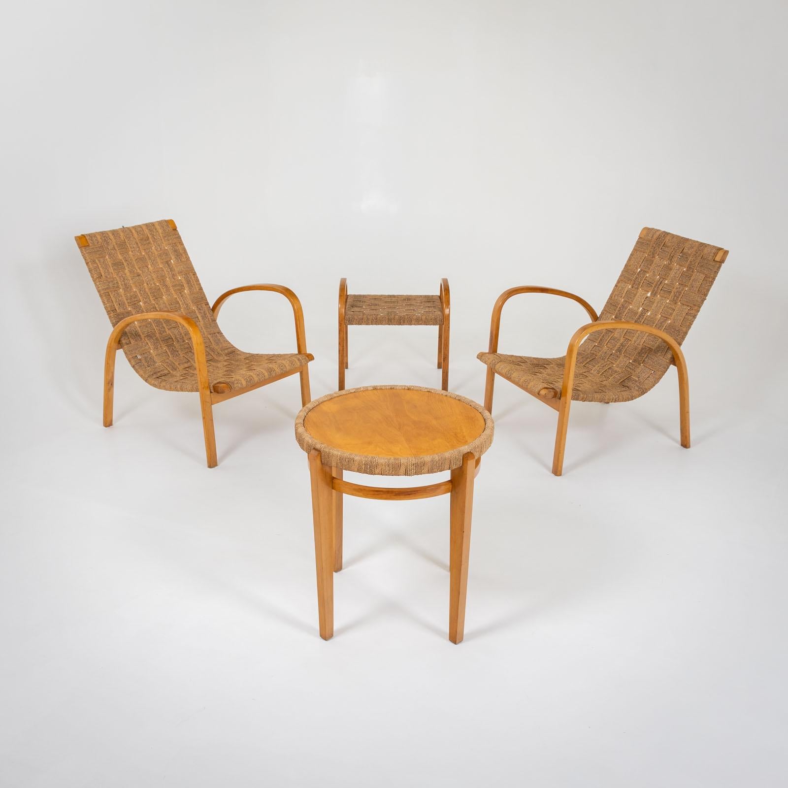Seating group consisting of two armchairs, a stool and a side table. The group is made of bentwood and covered with hemp ropes. Unrestored original condition.

Dimensions:
Armchairs: 82 x 60 x 80 x 29 cm
Stool: 51 x 51.5 x 43 x 40 cm
Table: 61 x Ø60