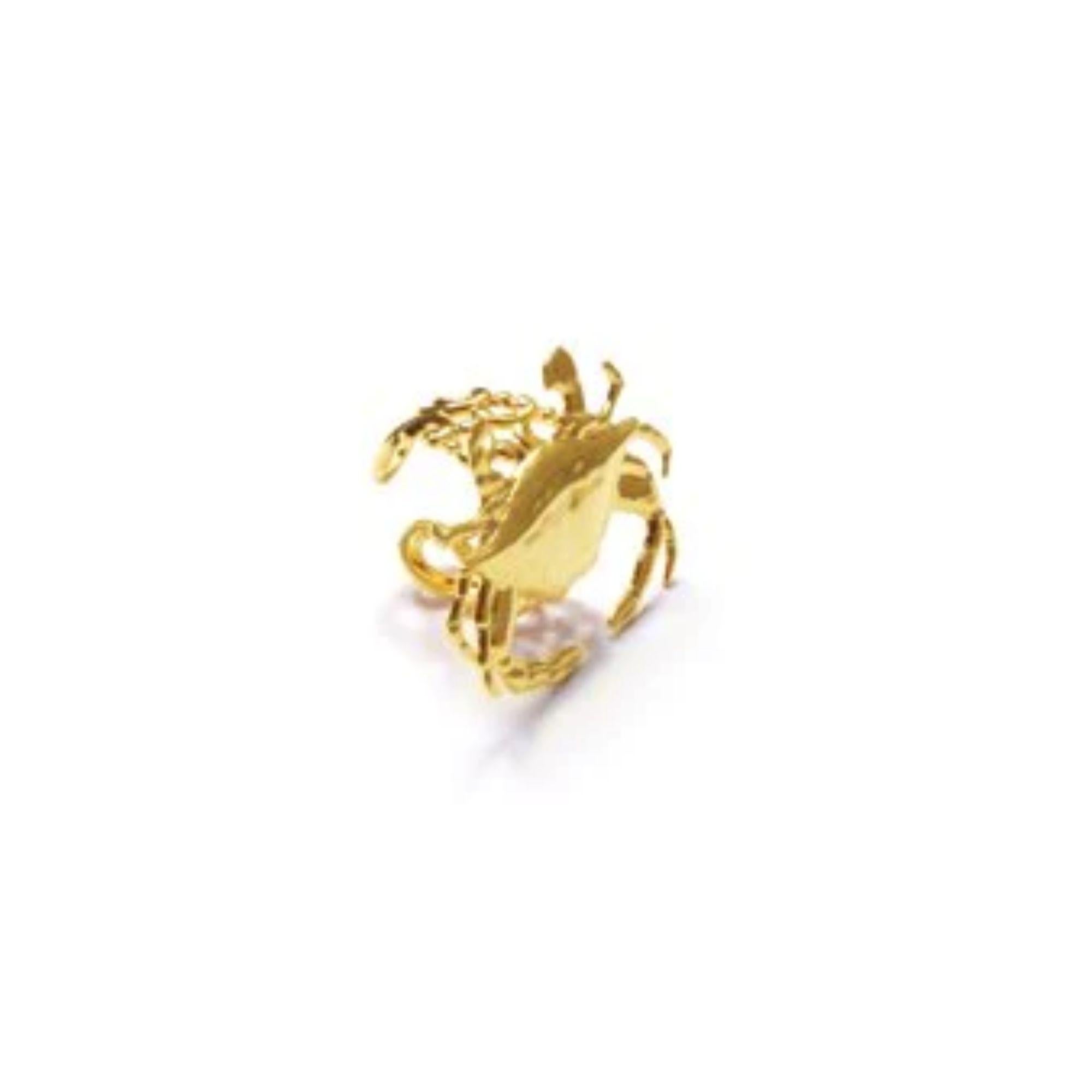 A fun, surreal-art Sebastian crab ring is the perfect conversation piece! Also a great zodiac Cancer ring! Ring is adjustable with a baroque design and can be finished in 24k yellow or rose gold. Made in America. Plated on Brass.

Additional