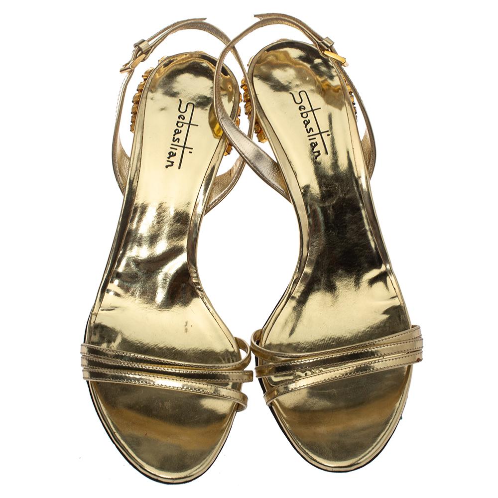 Statement sandals for you to outshine everyone else! These Sebastian beauties are crafted from gold leather and feature open toes with delicate vamp straps and slingbacks with buckle fastenings. They are endowed with comfortable leather-lined