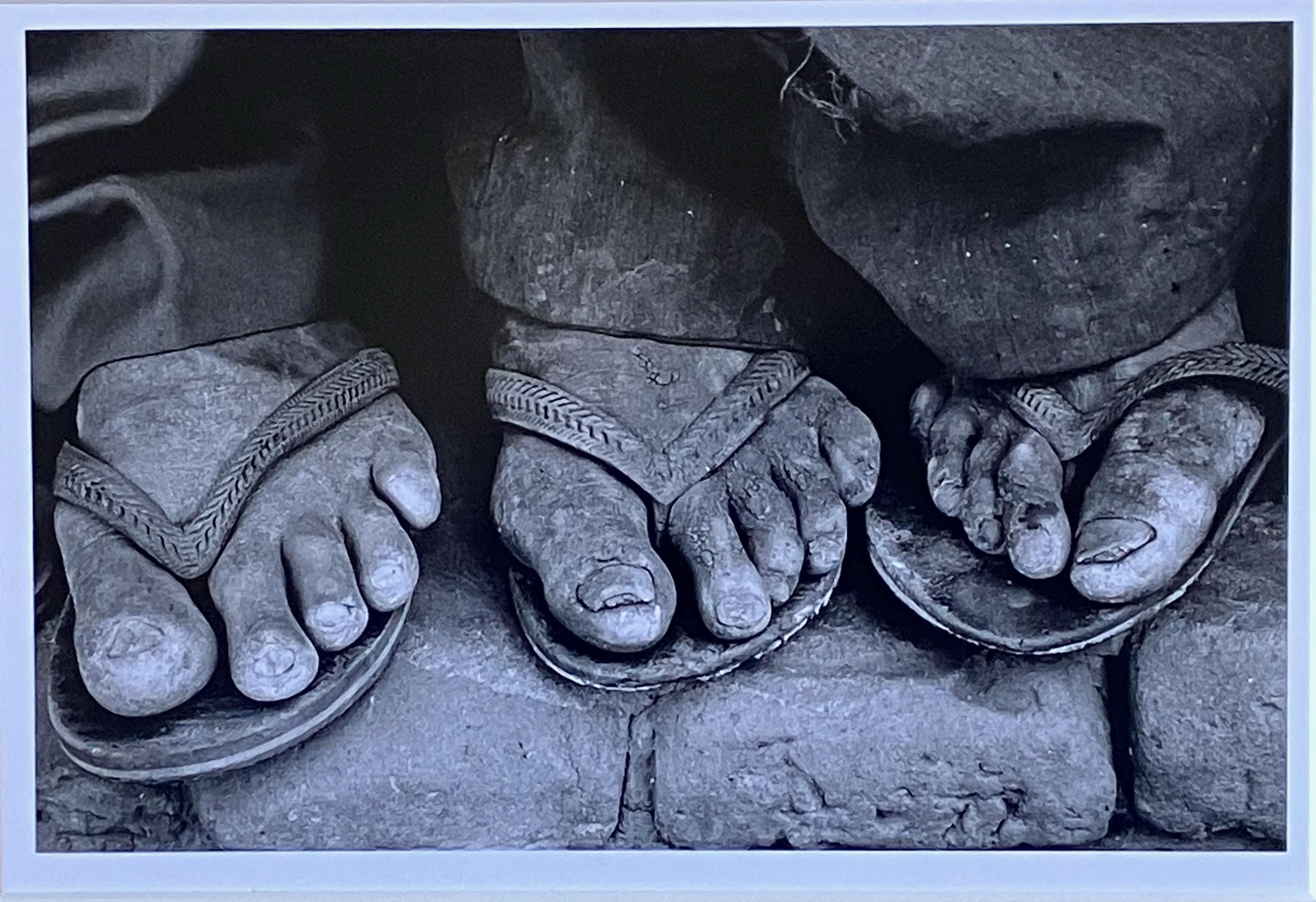 Artist: Sebastiao Salgado – Brazilian (1944-)
Title: Feet, Brazil
Year: 1983
Medium: Gelatin silver print
Sight size: 6 7/8 x 10.5 inches
Signature: Signed and dated on reverse. Blindstamp, lower margin.
Framed size: 12 7/8 x 16.25 inches
Condition: