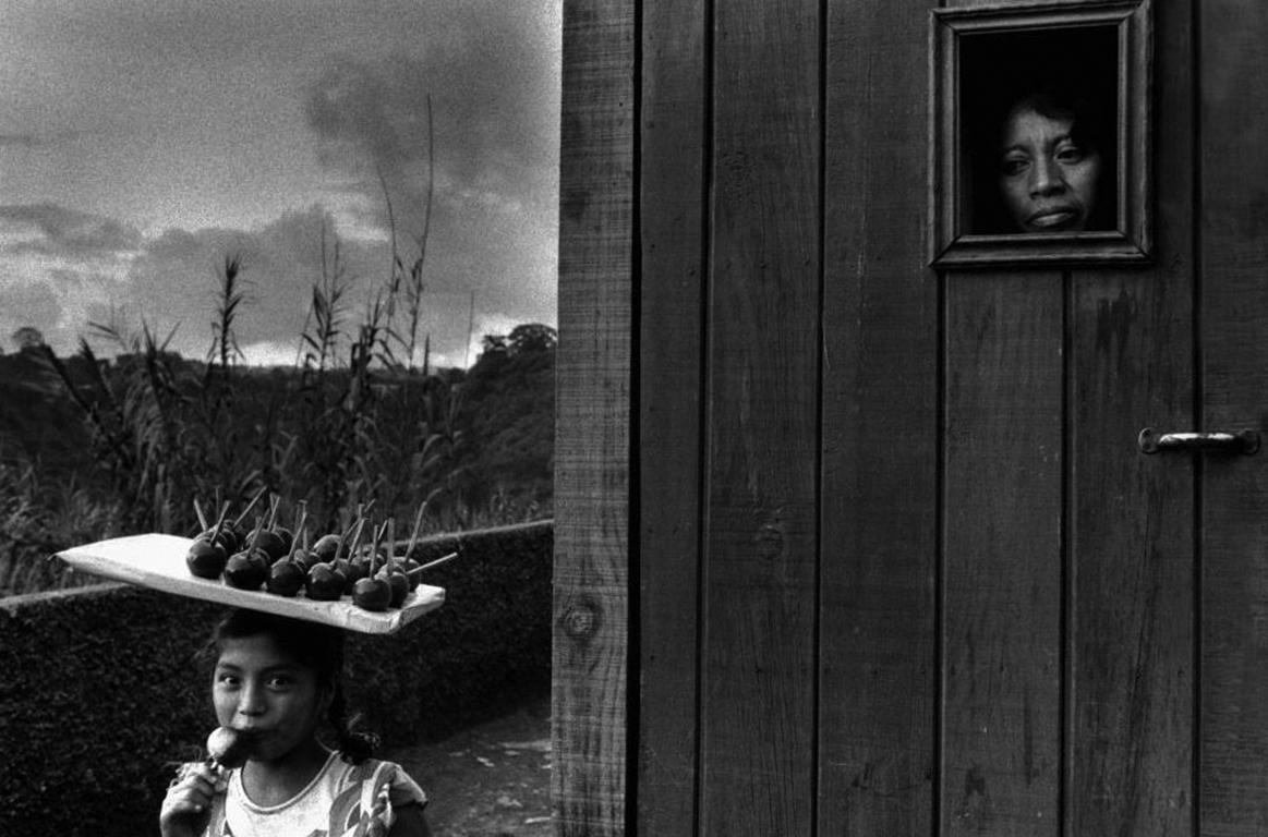 Sebastião Salgado Black and White Photograph - The Outskirts of Guatemala City, (girl with candy apples), Guatemala