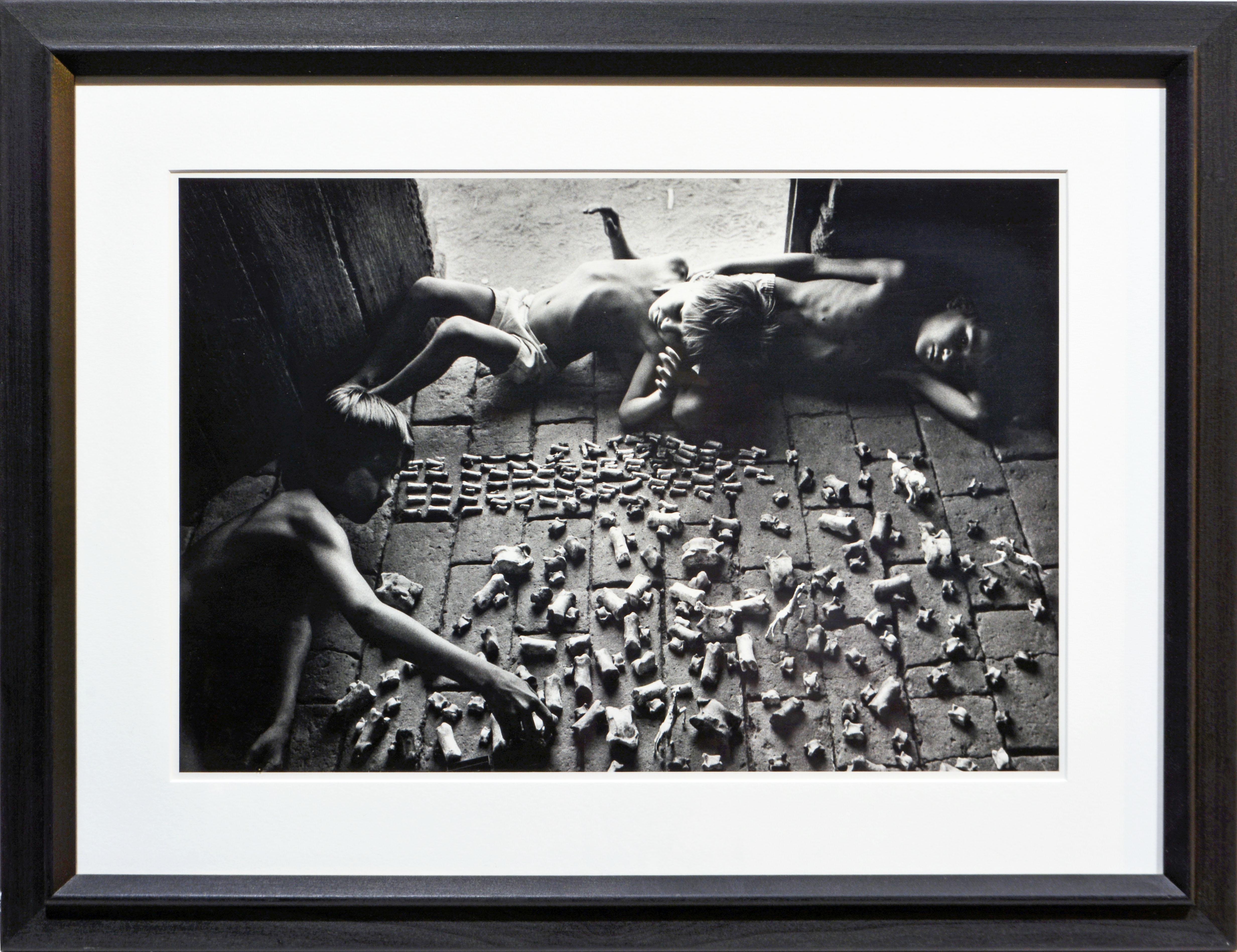 Sebastião Salgado (Brazil, born 1944)
'Boys at Play' from the Other Americas series.
Gelatin silver print, image: 12.75 x 17.5 in / 30 x 44 cm, full margins. Frame: 18.75 x 25 in / 33 x 48 cm.
Signed, blind stamped, dated, numbered and inscribed
