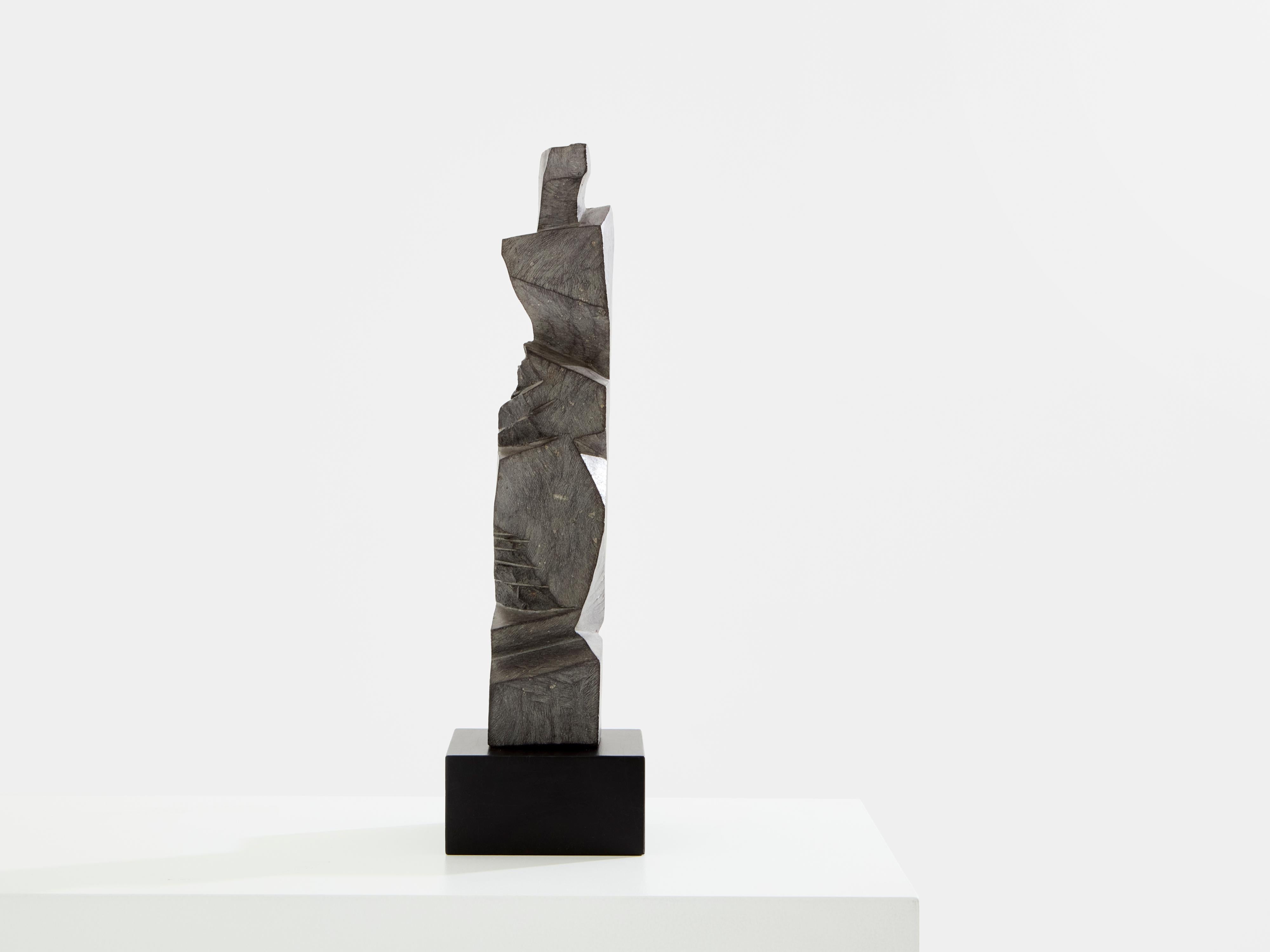 A beautiful brutalist Figueras stone totem sculpture by Sébastien Touret realized in the early 2010s. The raw details are exquisite, and this sculpture feels both strong and sensual. Mounted on a painted metal base. Dimensions including the metal