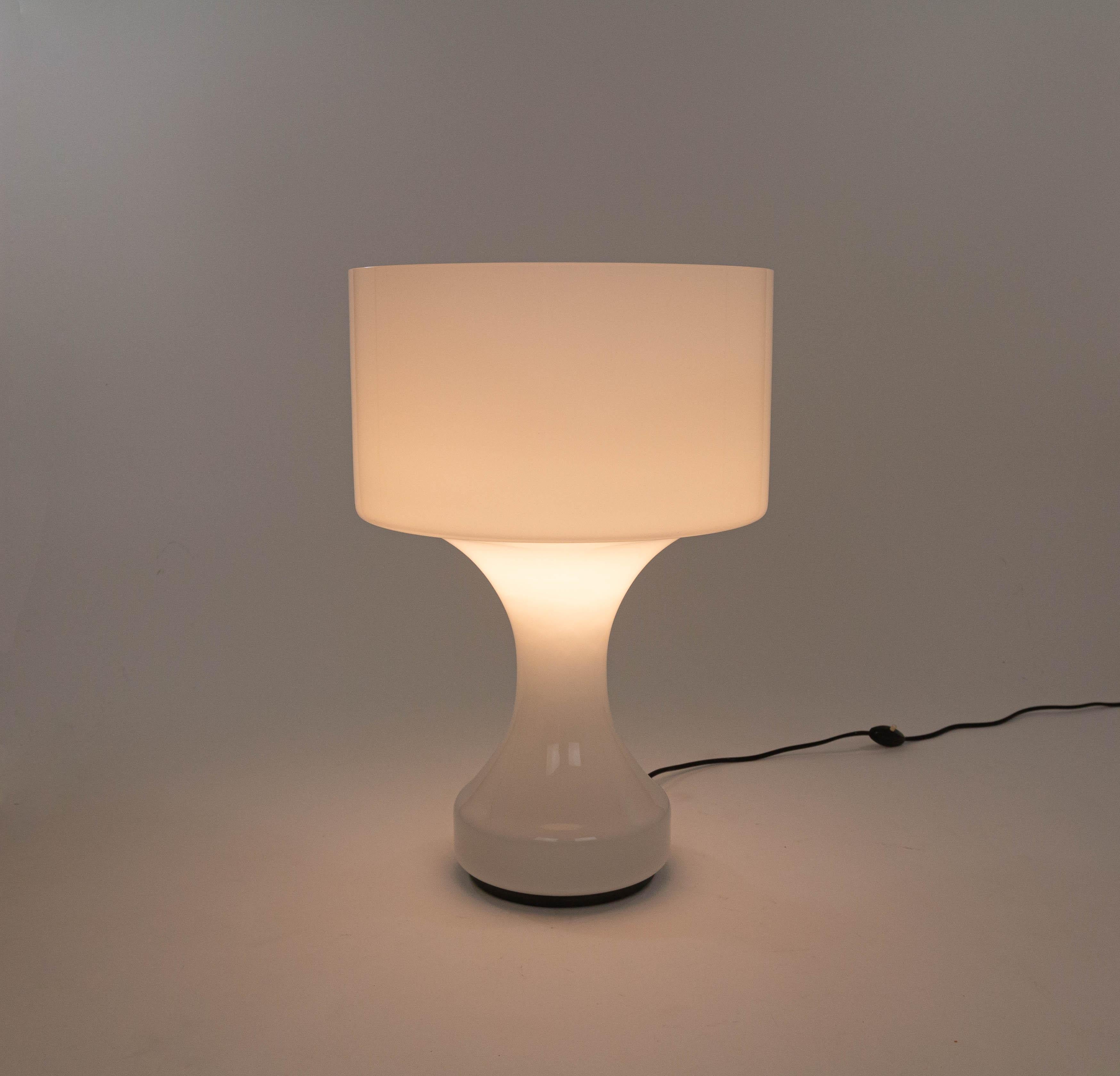 Large Model L 190 or Sebenica table of floor lamp designed in 1965 by Enrico Capuzzo and manufactured by Vistosi.

This impressive lamp consists of a surprisingly large blow-molded single glass with an elegant glass bowl inside as a diffuser to