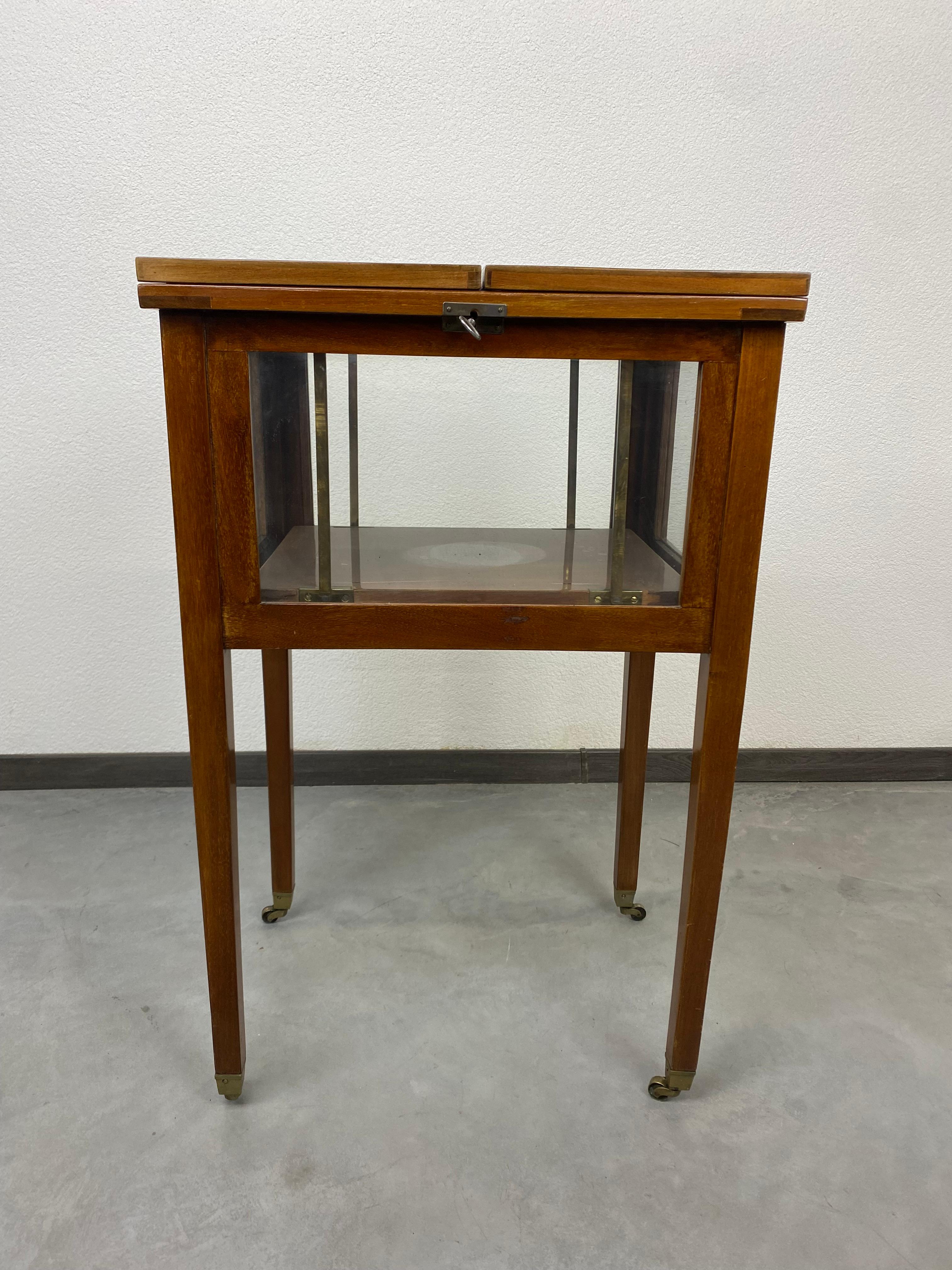 Secession bar table. When opened, a shelf wtih alcohol comes out. Two female nudes appear on the inside. These are the prints under the glass. Overall condition is fine with signs of usage. Total width after expansion is 100cm.