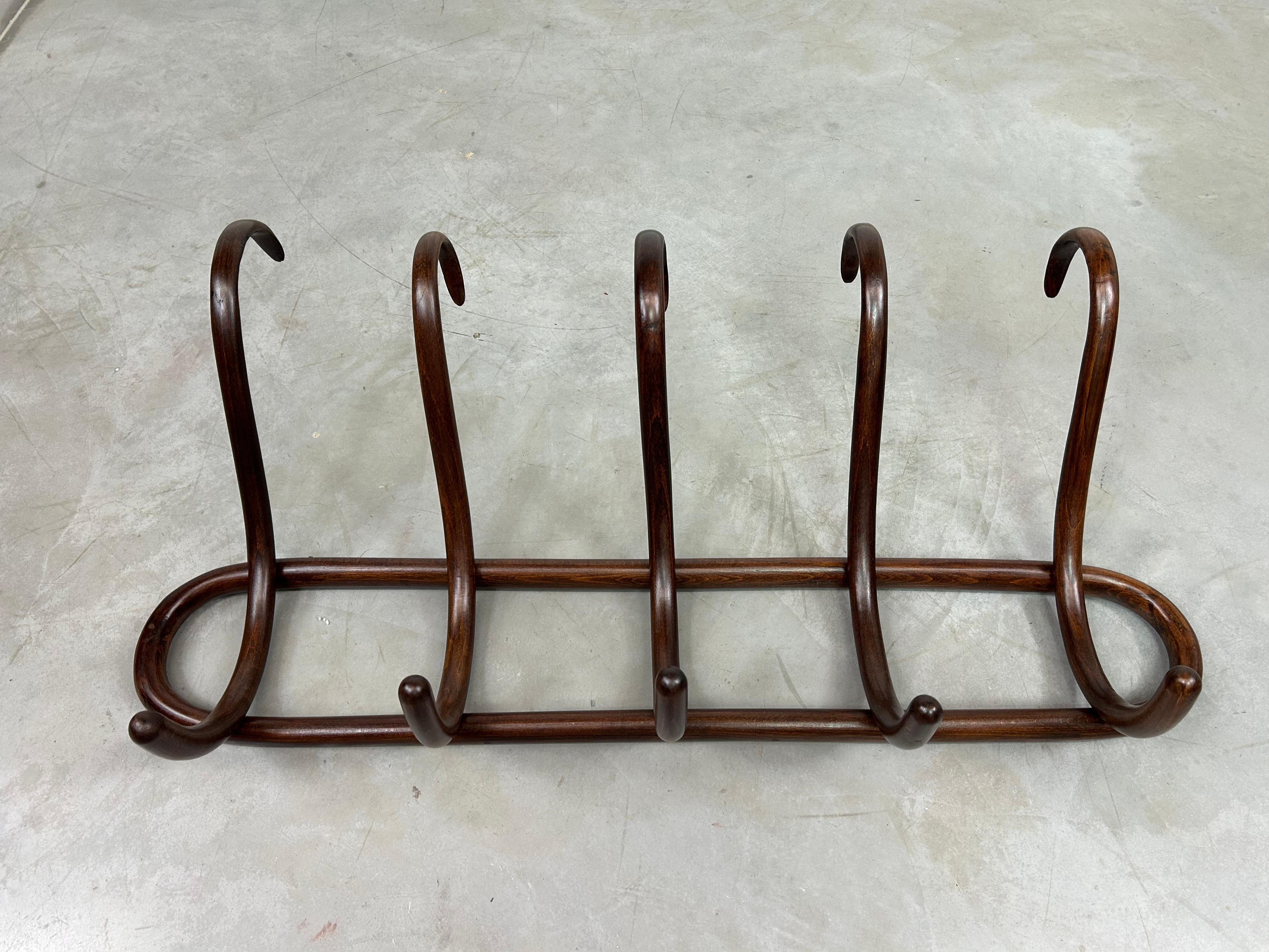 Secession wall hanger by Thonet. Professionally stained and repolished.