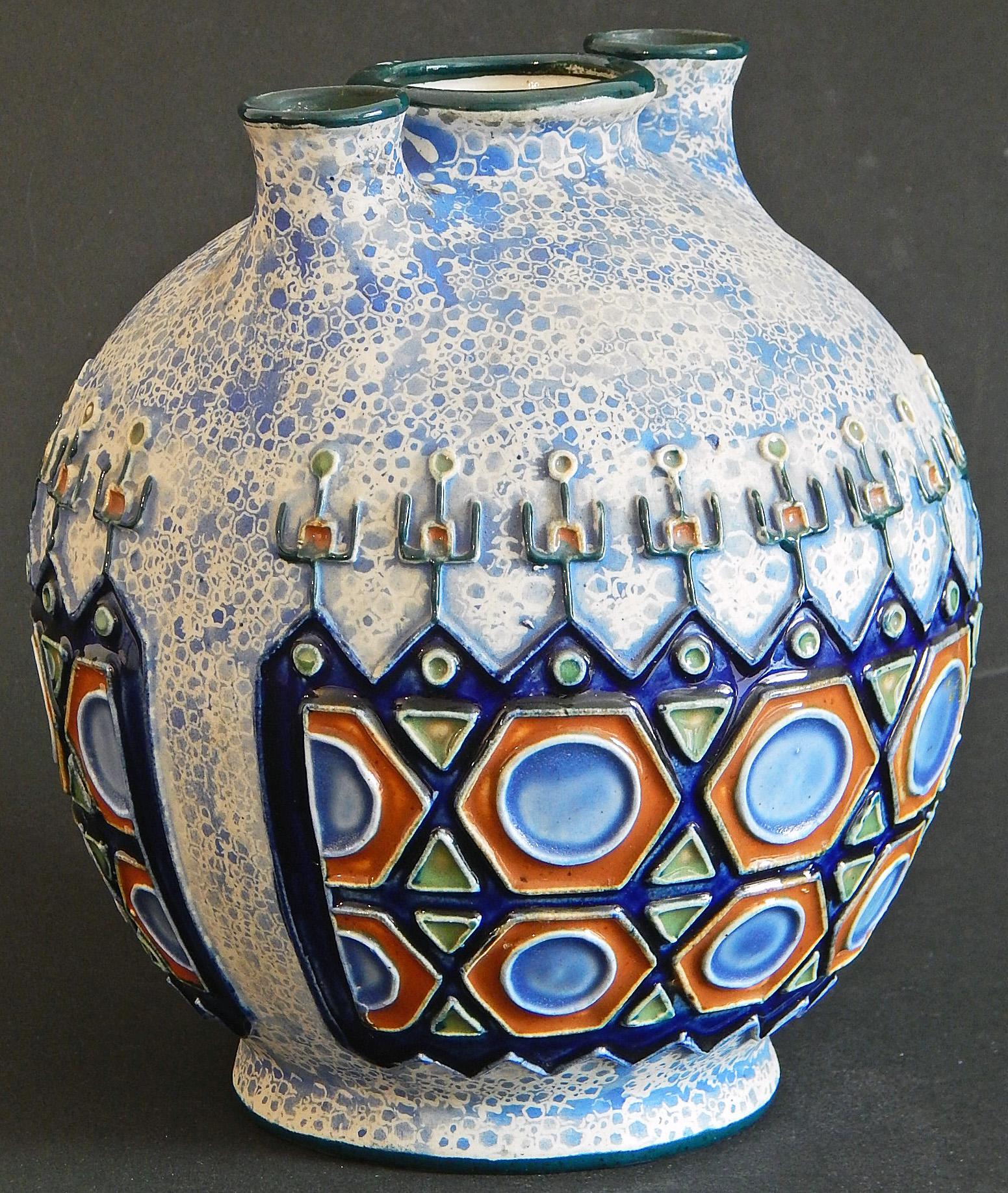 Rare and gorgeously glazed, this remarkable vase finished in rich, deep blues, golds and white, was produced the famed Amphora pottery works in the Czech Republic, during the nation's short period of independence in the 1920s and 1930s, between the