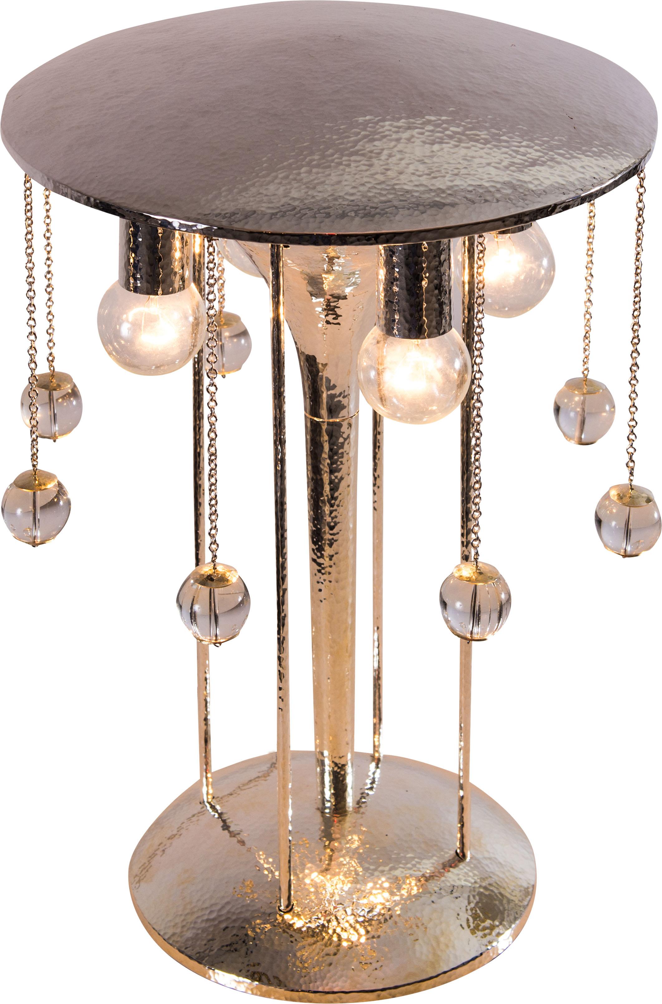Wonderful, very elaberate table lamp, silvered brass, the original is displayed in gallery 910 at the Metropolitan Museum New York. Also available in a plain, non-wrought version.
Material used is silvered brass, hammered.
Originally manufactured at