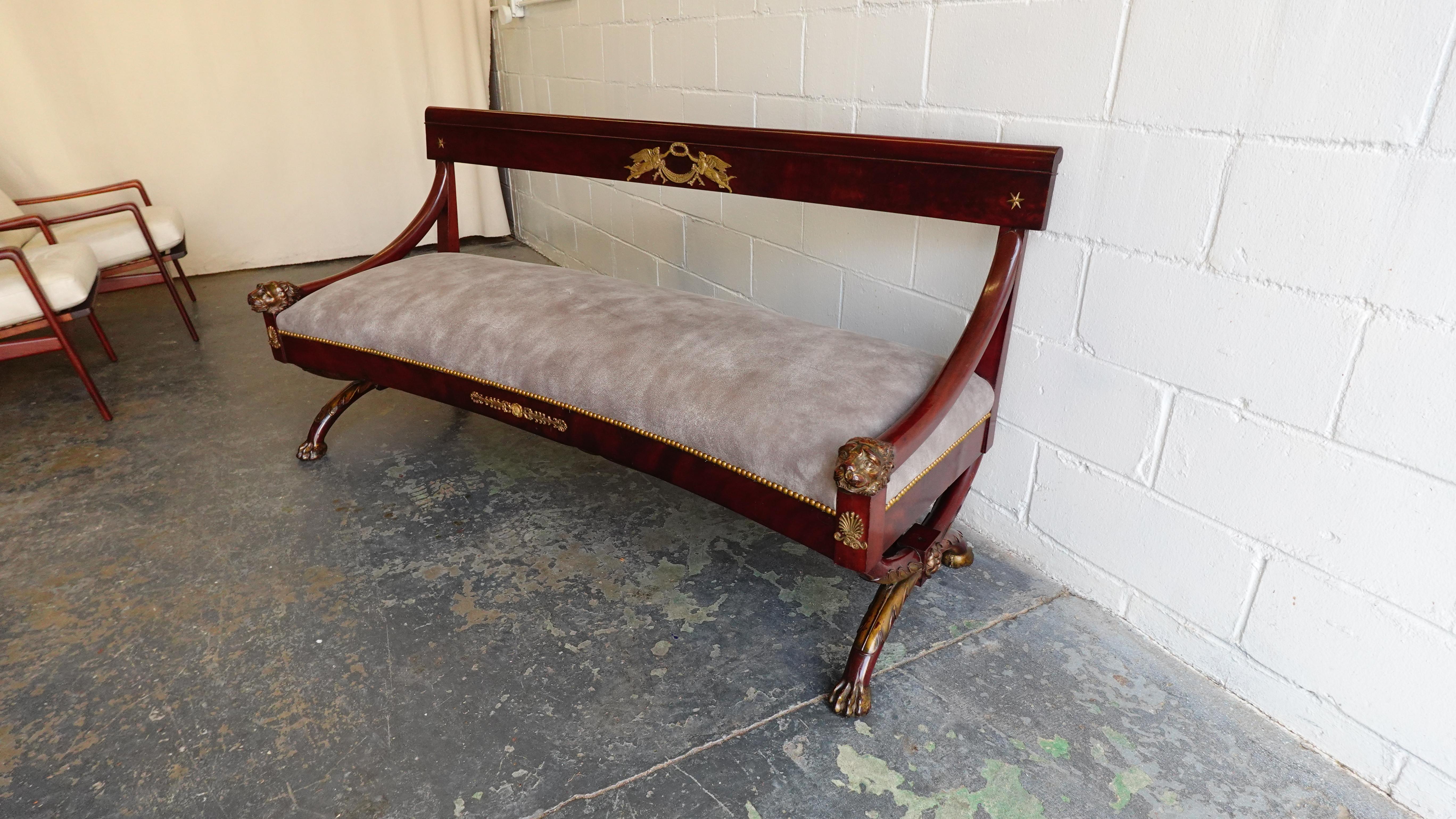 A fine and well preserved mahogany & gilt bronze canapé from the Second Empire Period under the reign of Napoleon III. Absolutely wonderful condition, seat cushion has been redone in a lovely full grain textured grey leather—traditional sprung seat