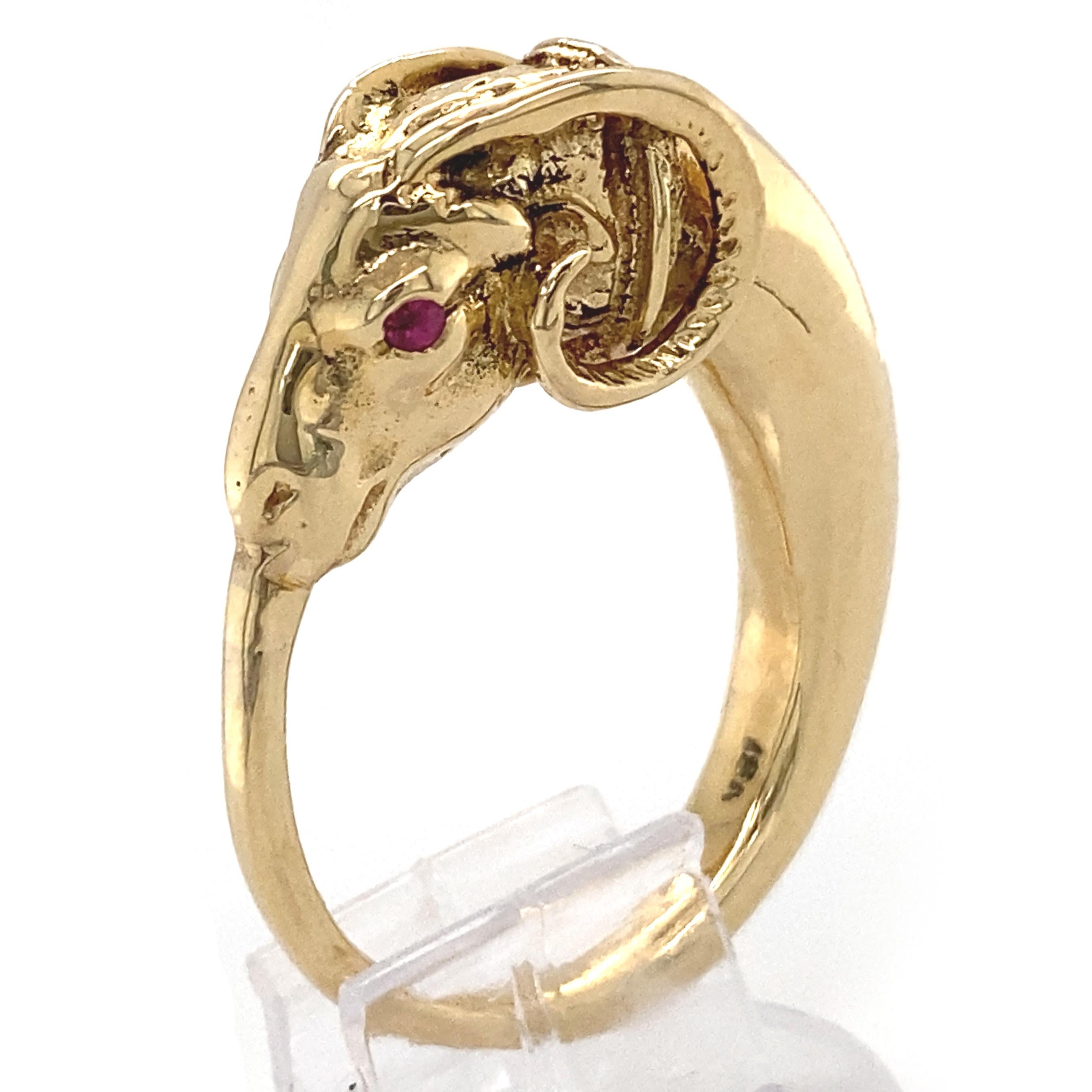 This striking figural ring is sort of a modified ouroboros -- the ancient round symbol of a snake eating its own tail -- only here the snake has the head of a ram.  This whimsical mash-up of motifs puts it squarely in the mini-Etruscan revival of