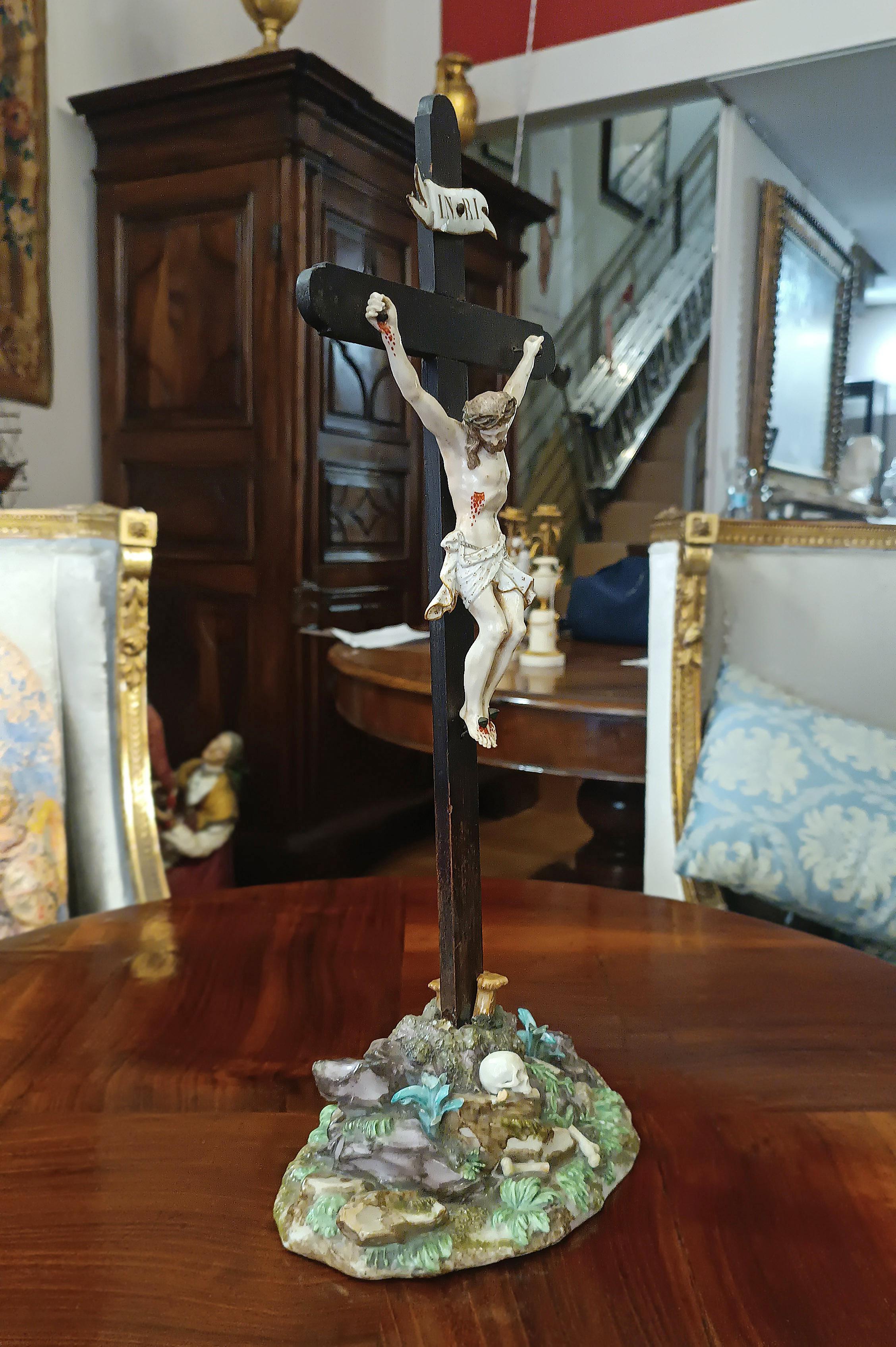 Beautiful polychrome porcelain crucifix from the Meissen factory, one of the oldest and most prestigious European porcelain manufacturers. The brand is clearly visible under the base of the crucifix and is distinguished by the star beneath two