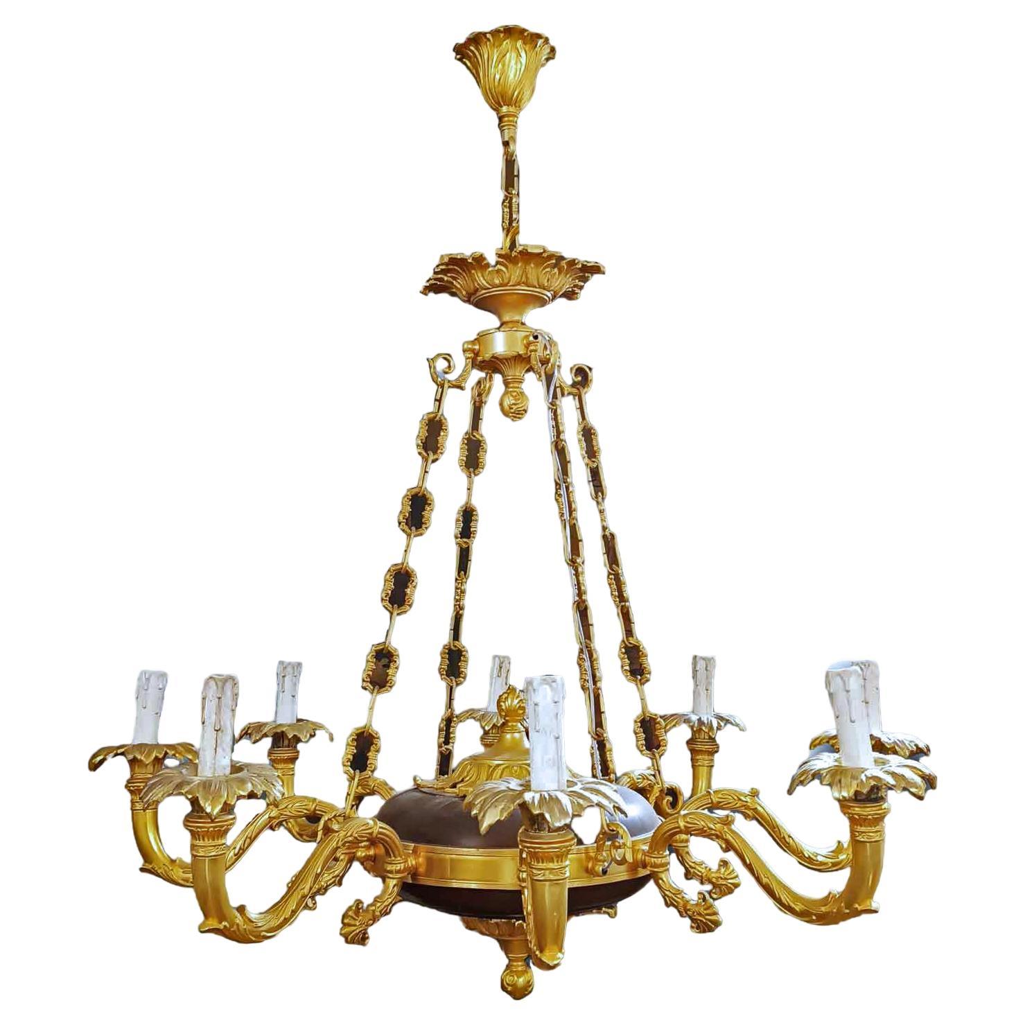 SECOND HALF OF THE 19th CENTURY CHANDELIER IN GOLDEN AND PATINATED BRONZE  For Sale