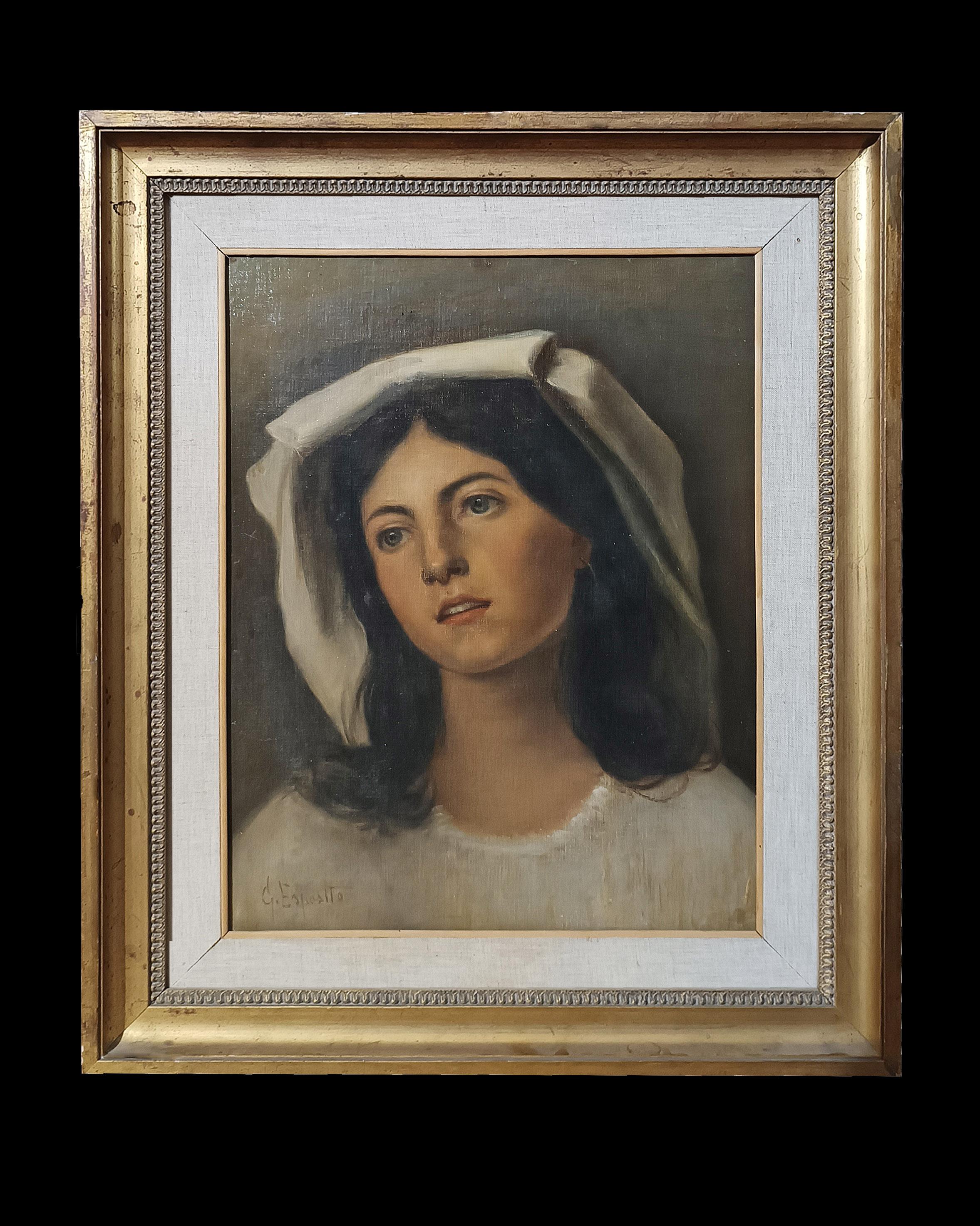 Beautiful oil painting on canvas framed in an elegant canvas frame and inside a carved and gilded frame with mirror. The work portrays a young woman with enchanting features, dark hair and blue eyes. The girl's gaze is directed towards a distant