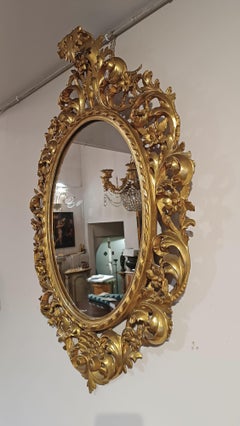 SECOND HALF OF THE 19th CENTURY OVAL GILDED MIRROR
