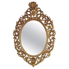 SECOND HALF OF THE 19th CENTURY OVAL GILDED MIRROR