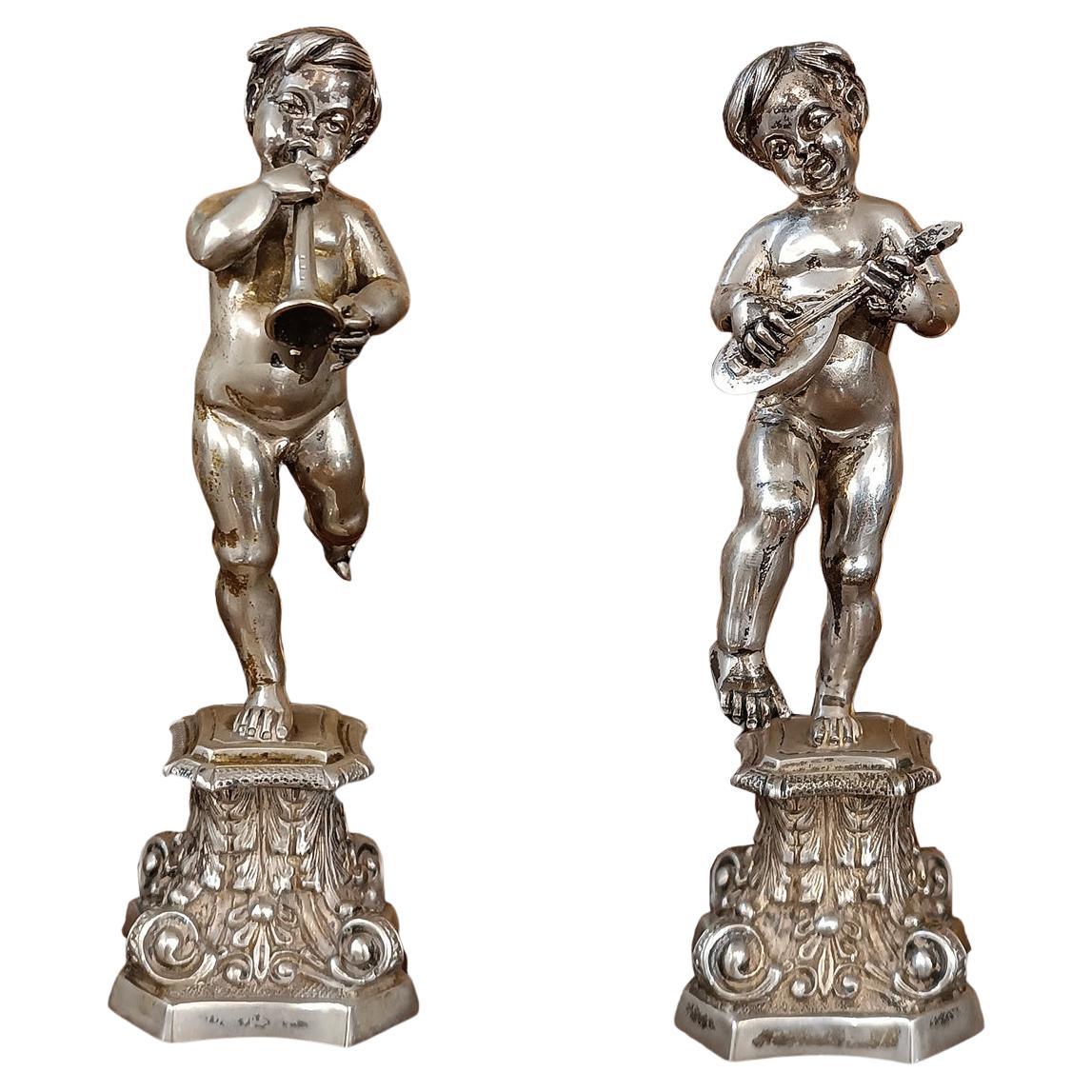 SECOND HALF OF THE 19th CENTURY PAIR OF SILVER CUPIDS