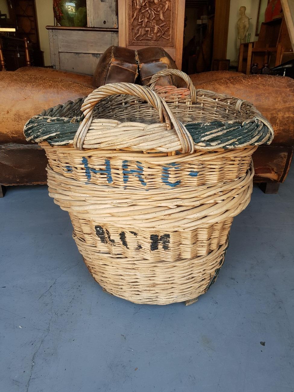 Vintage French champagne wicker grapes basket from the Reims region, second half of the 20th century.

The measurements are:
Depth 68 cm/ 26.7 inch.
Width 85 cm/ 33.4 inch.
Height 58 cm/ 22.8 inch.