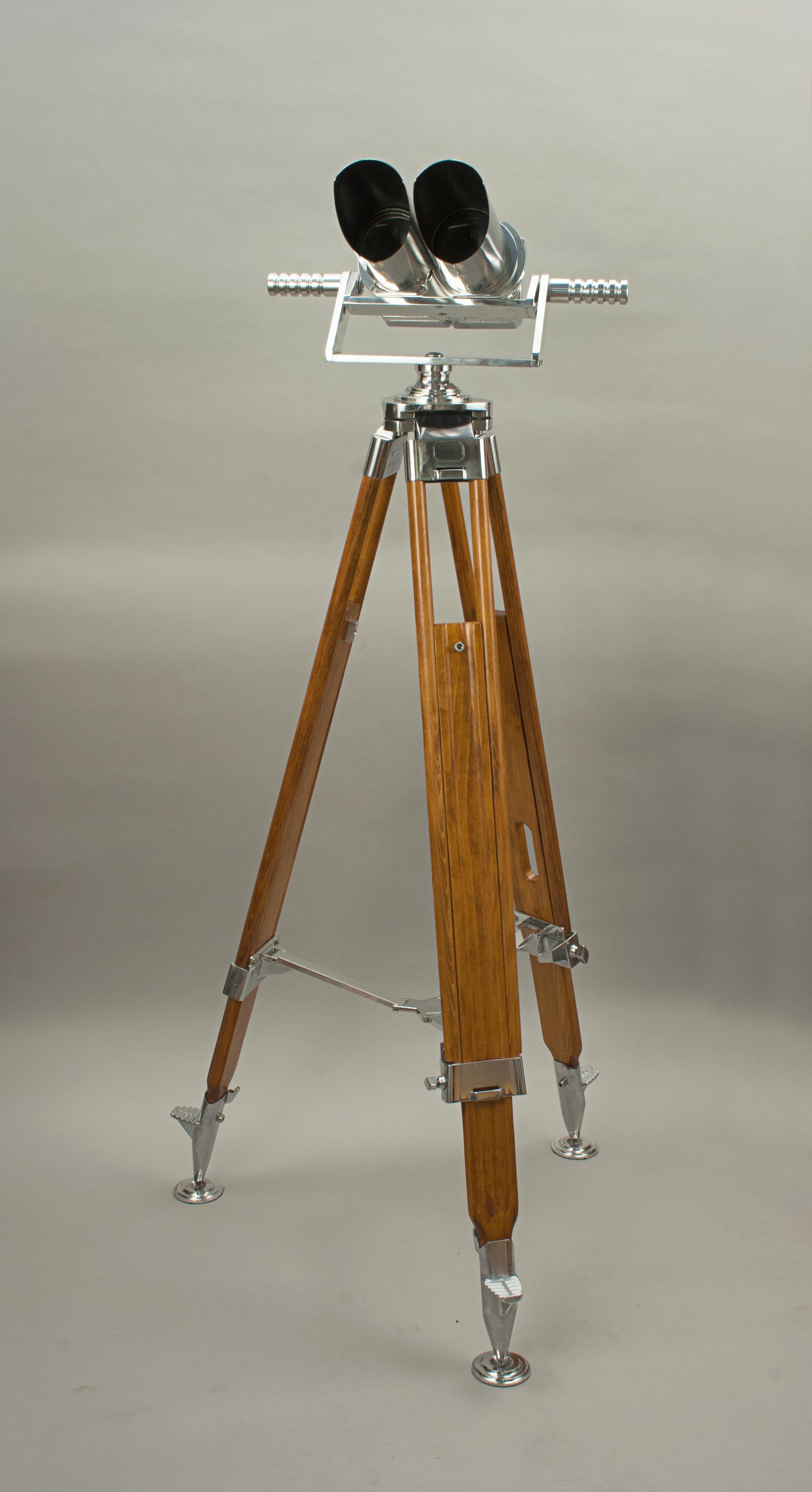 German Second World War Hensoldt Wetzlar Observation Binoculars, 10 x 80.
A pair of German ex-military observation binoculars mounted on a modern aluminium cradle and gimble with vintage adjustable wooden tripod. The binoculars with 45º incline