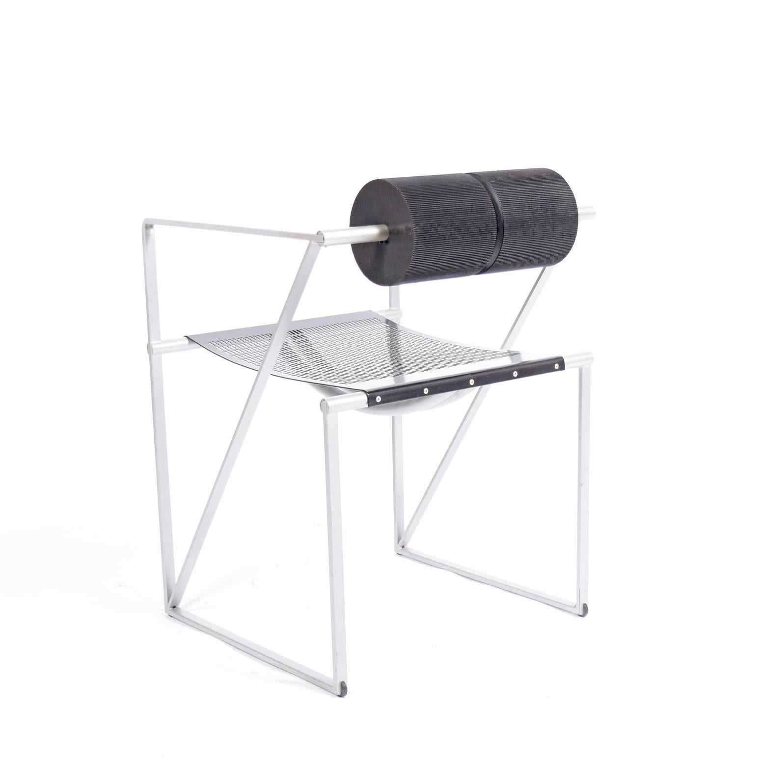 Early production armchair designed in 1982. Features silver epoxy finished frame, black enamore perforated sheet steel seat and back with charcoal colored polyurethane foam.