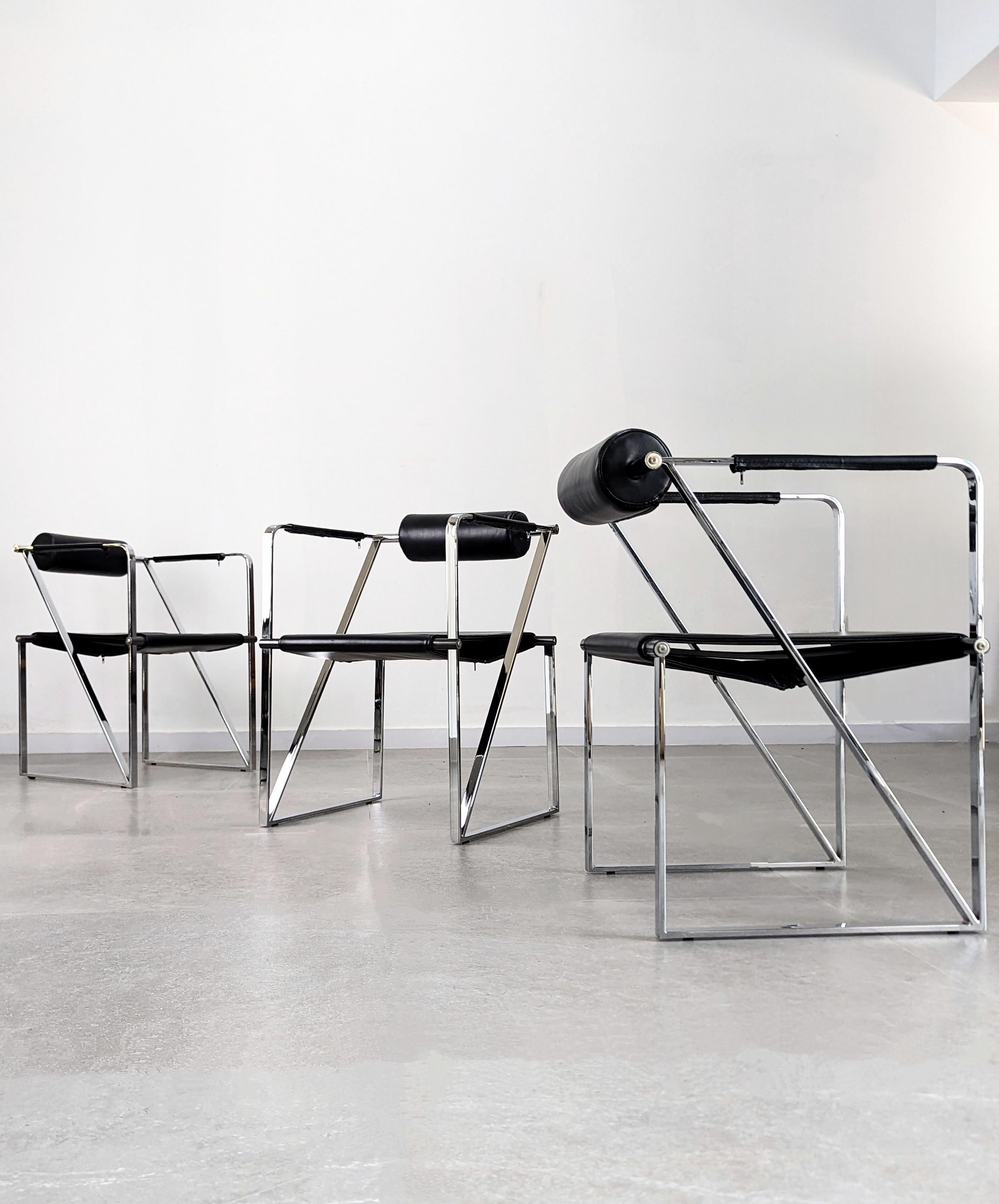 Spectacular set of three Seconda chairs designed by Mario Botta from the 80s made in chrome and black leather is a rare version of this design icon. The Seconda armchair, designed by Mario Botta in 1982, is characterized by its geometric shapes that