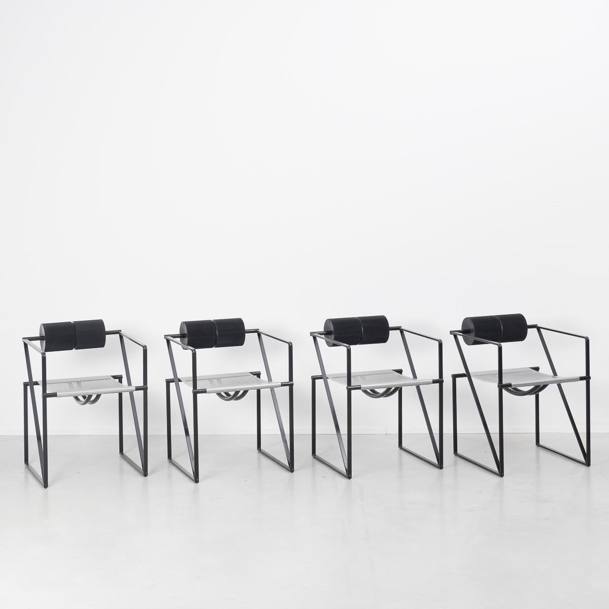 As you can see, we have a bit of a thing for Mario Botta. We are gradually amassing his whole collection. The Seconda chair is perhaps one of his most iconic pieces. This set of early period produced chairs are, like most of his designs, are made