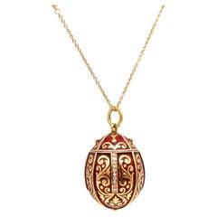 SECRET BOX In Form eines emaillierten Ei-Anhängers aus 18 Karat Gold mit Diamanten