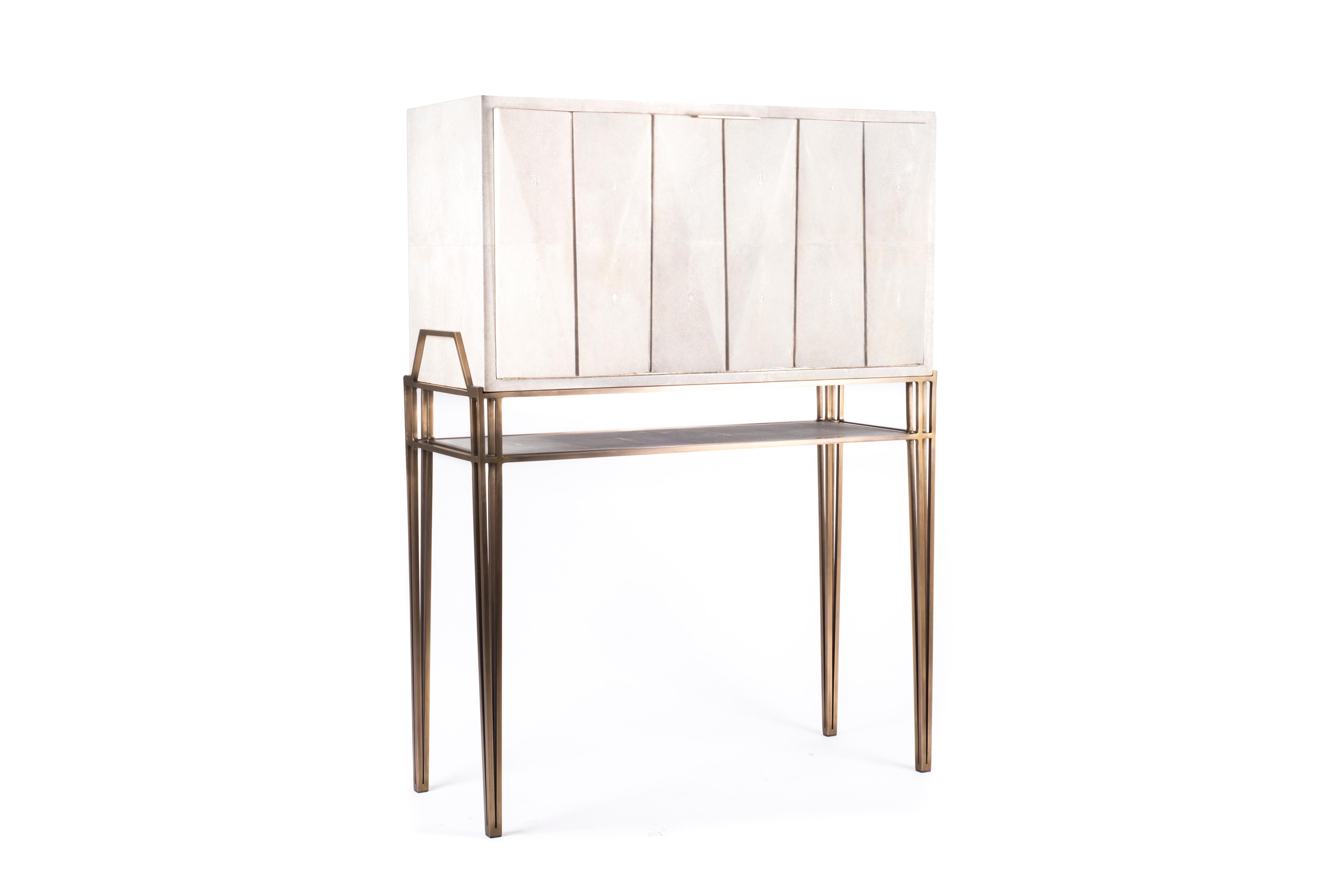 The secrétaire desk is the perfect functional working unit. The flap top opens up into a desk with several compartments, inlaid in shagreen and wood veneer, to store items and once closed offers a beautiful piece to look at. The top removable piece