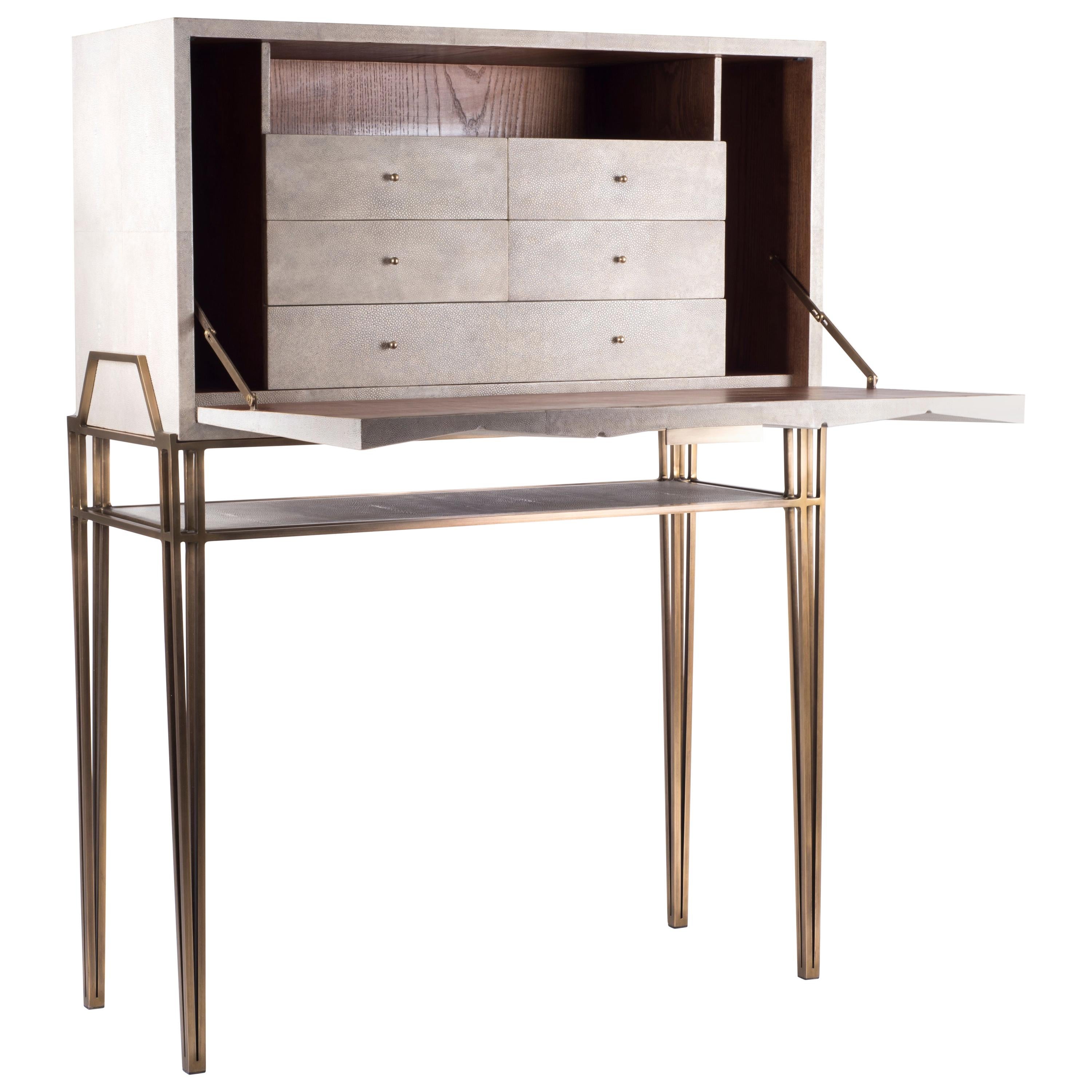 The secrétaire desk is the perfect functional working unit. The flap top opens up into a desk with several compartments, inlaid in shagreen and wood veneer, to store items and once closed offers a beautiful piece to look at. The top removable piece