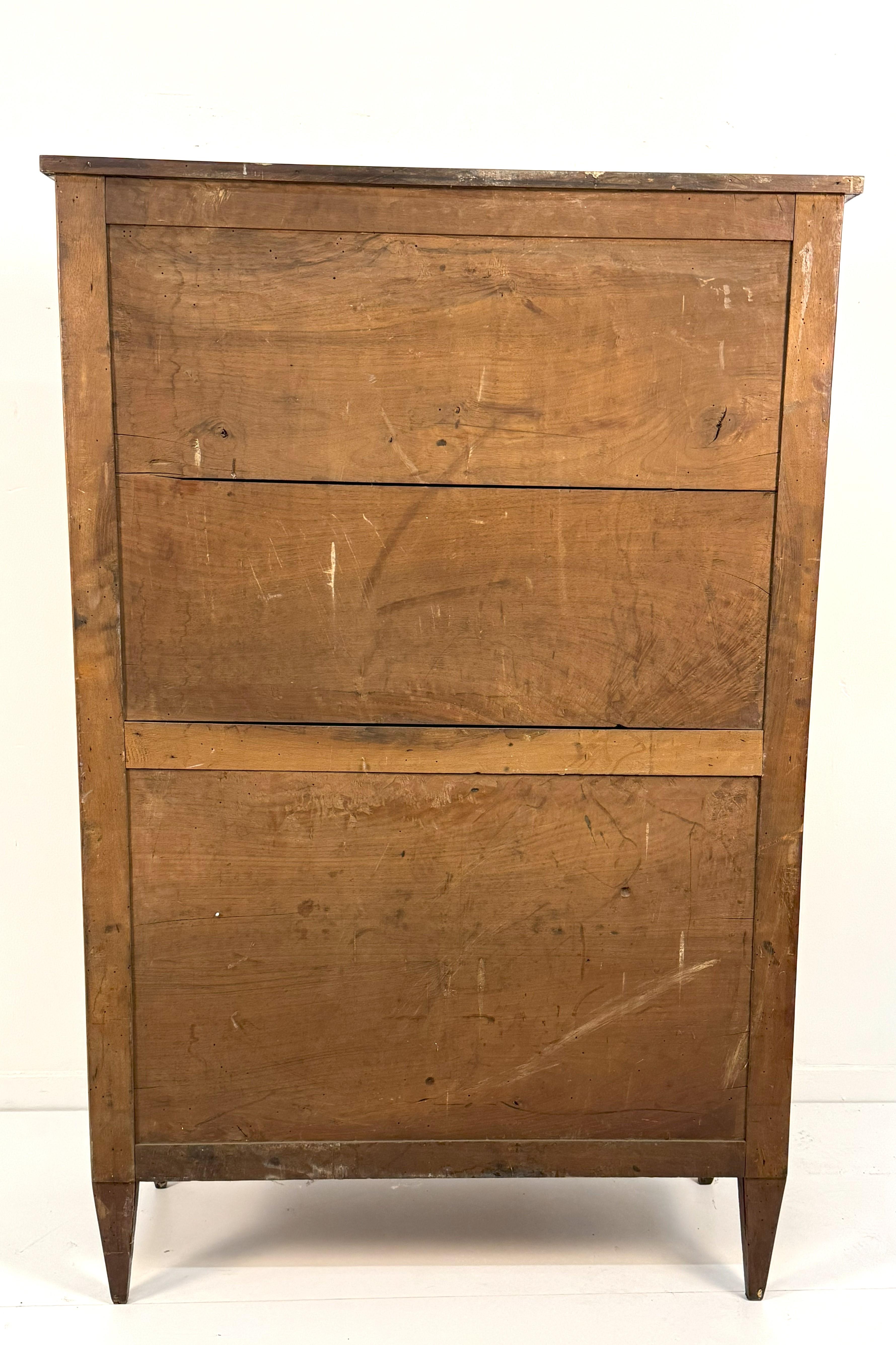 Secretaire, Lombardy, late 18th century, body entirely panelled in herringbone bois de rose, two-door front surmounted by a calatoia decorated with a central medallion with whirls and basketwork concealing inside, four small drawers and multiple