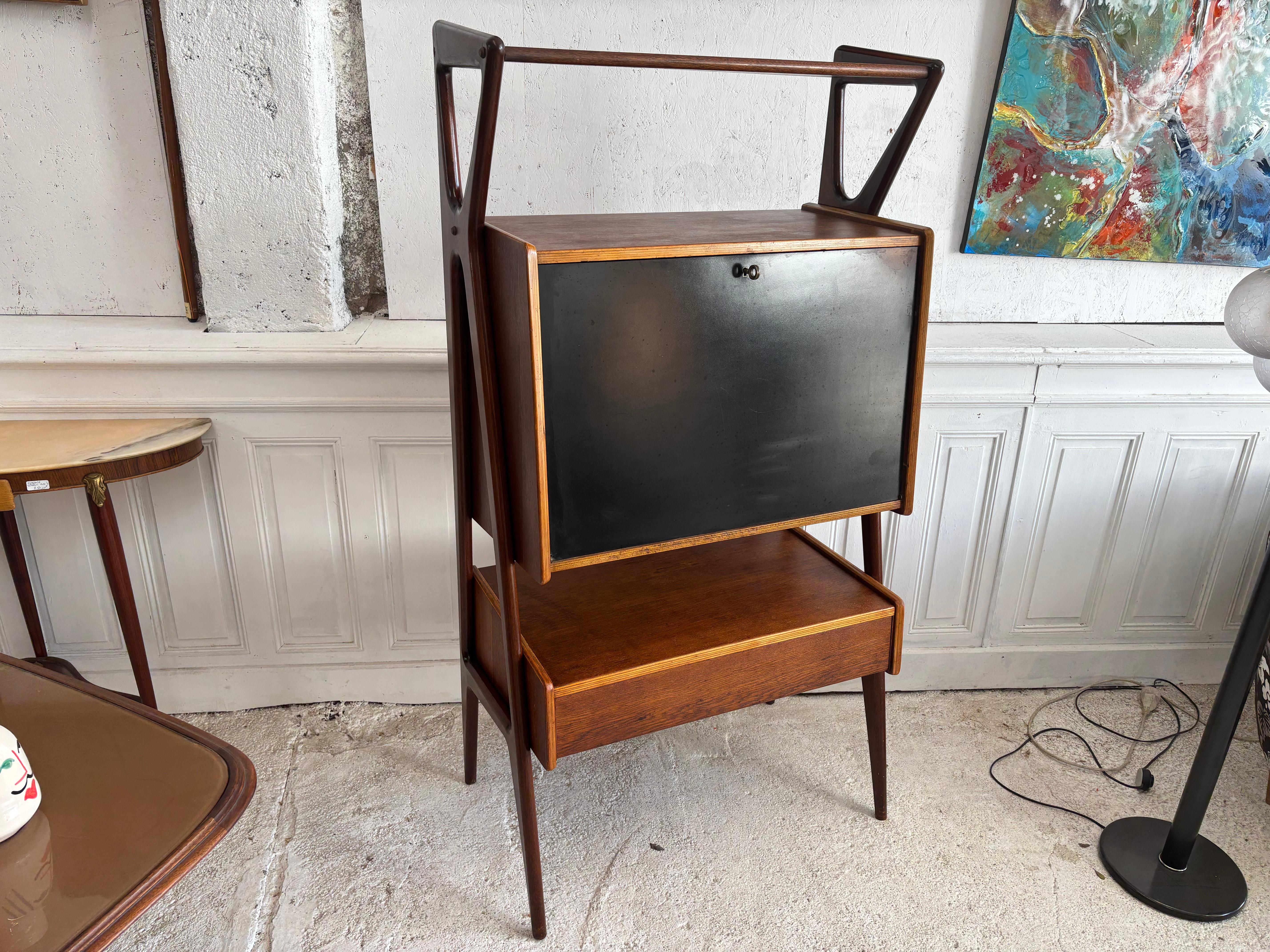 Beautiful secrétaire furniture designed by Louis Paolozzi for the French manufacturer René Godfroid. With this piece of furniture, Paolozzi introduced the famous Italian design of the 1950s in the René Godfroid collection.

All structure is in honey