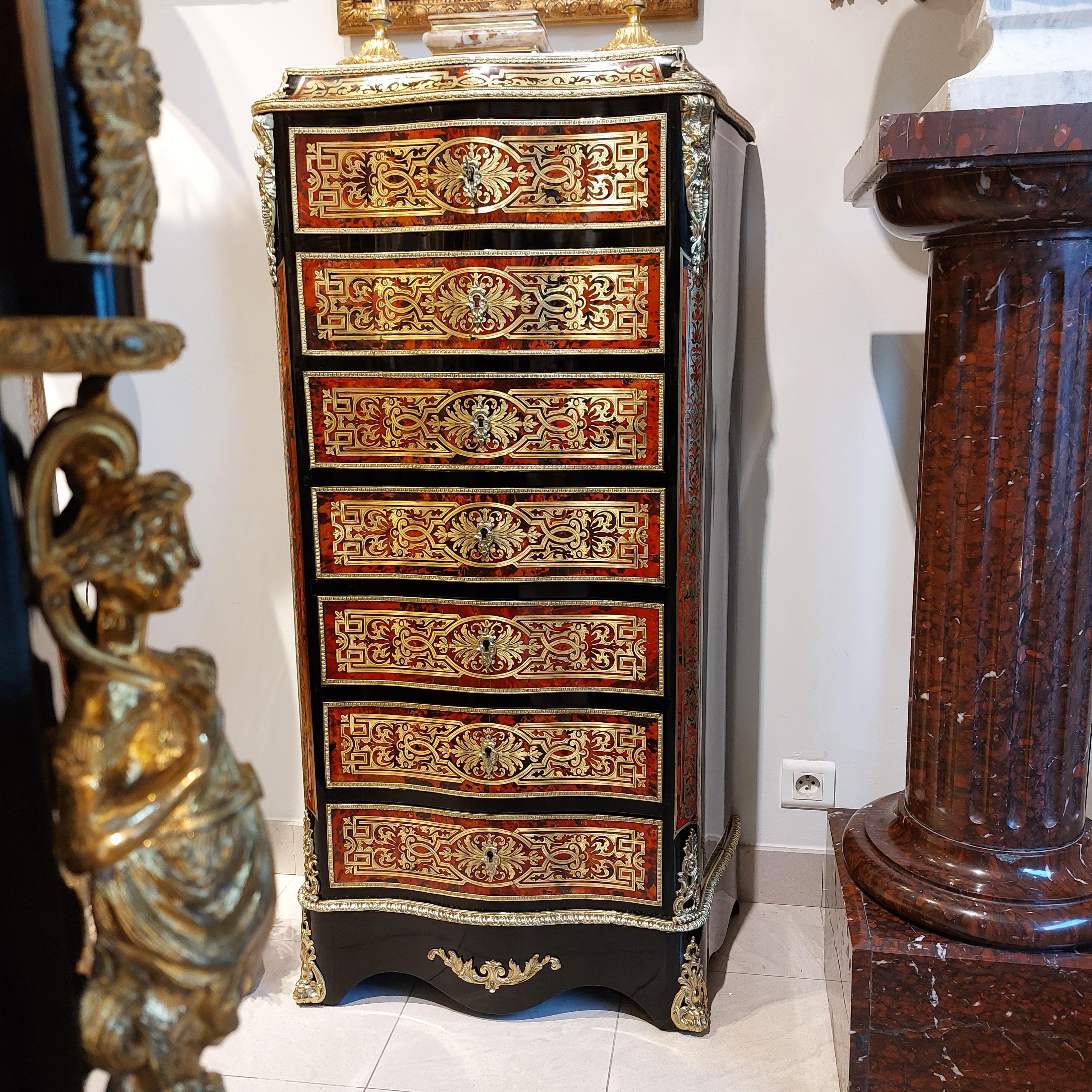 Napoleon III secretary in Boulle tortoiseshell marquetry and brass, patterned with interlacing, scrolls and foliage. 
Treated in false week : facade with 7 drawers : four drawers and a flap simulating three drawers. Theater with three drawers, two
