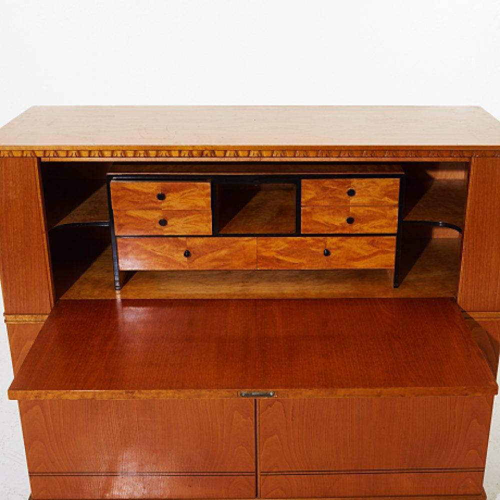 Secretary desk, Art Deco, birch, blackened details, writing desk with decoration on the top. Dimensions: H 117.5, W 127 x D 45 cm, keys available. Condition: Good condition, slight marks due to age and use, blows on the feet.