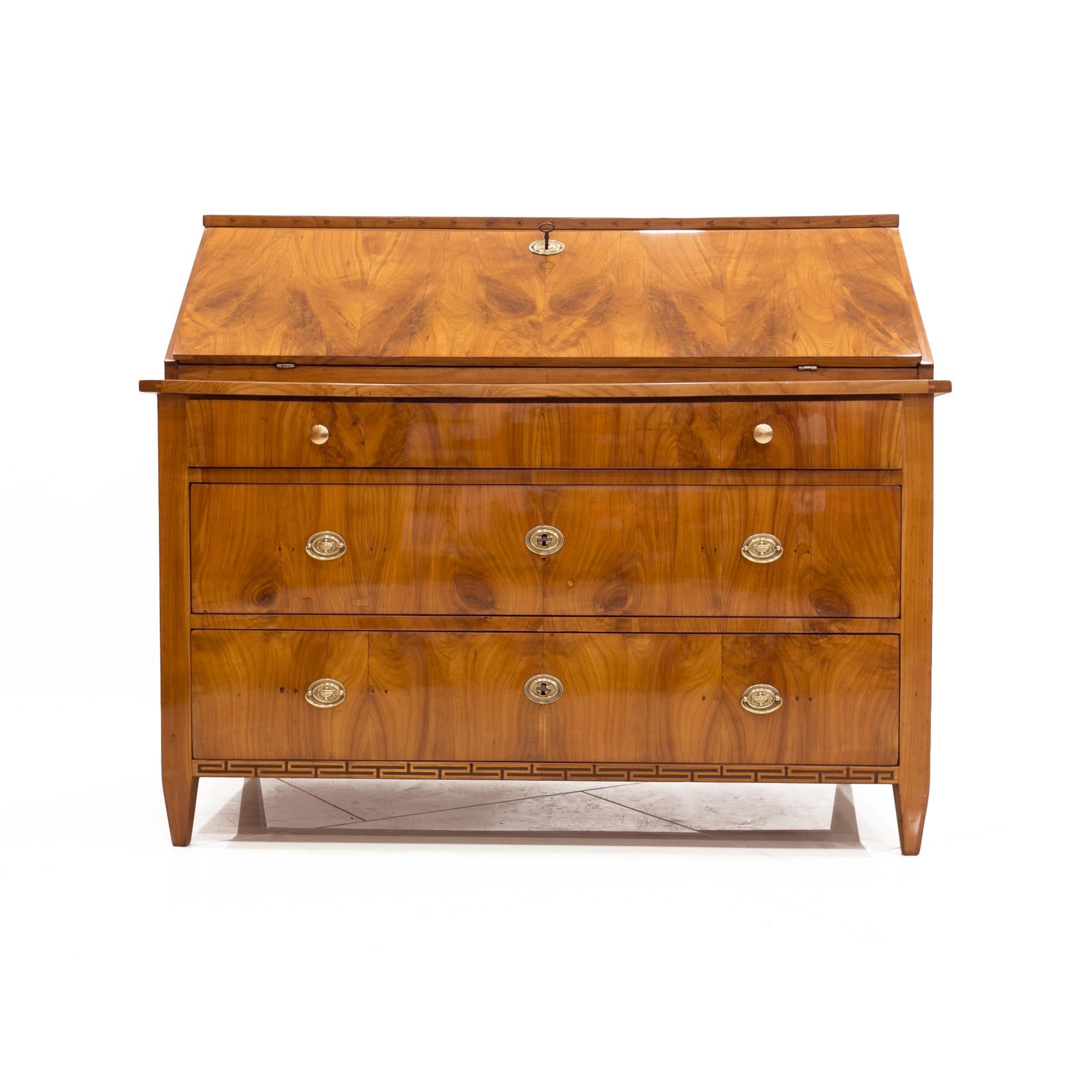 This Biedermeier secretary comes from Germany and was constructed, circa 1825. It is made of coniferous wood, veneered with cherrywood with beautiful wood patterns. This secretary desk has undergone a professional renovation process. Surface is