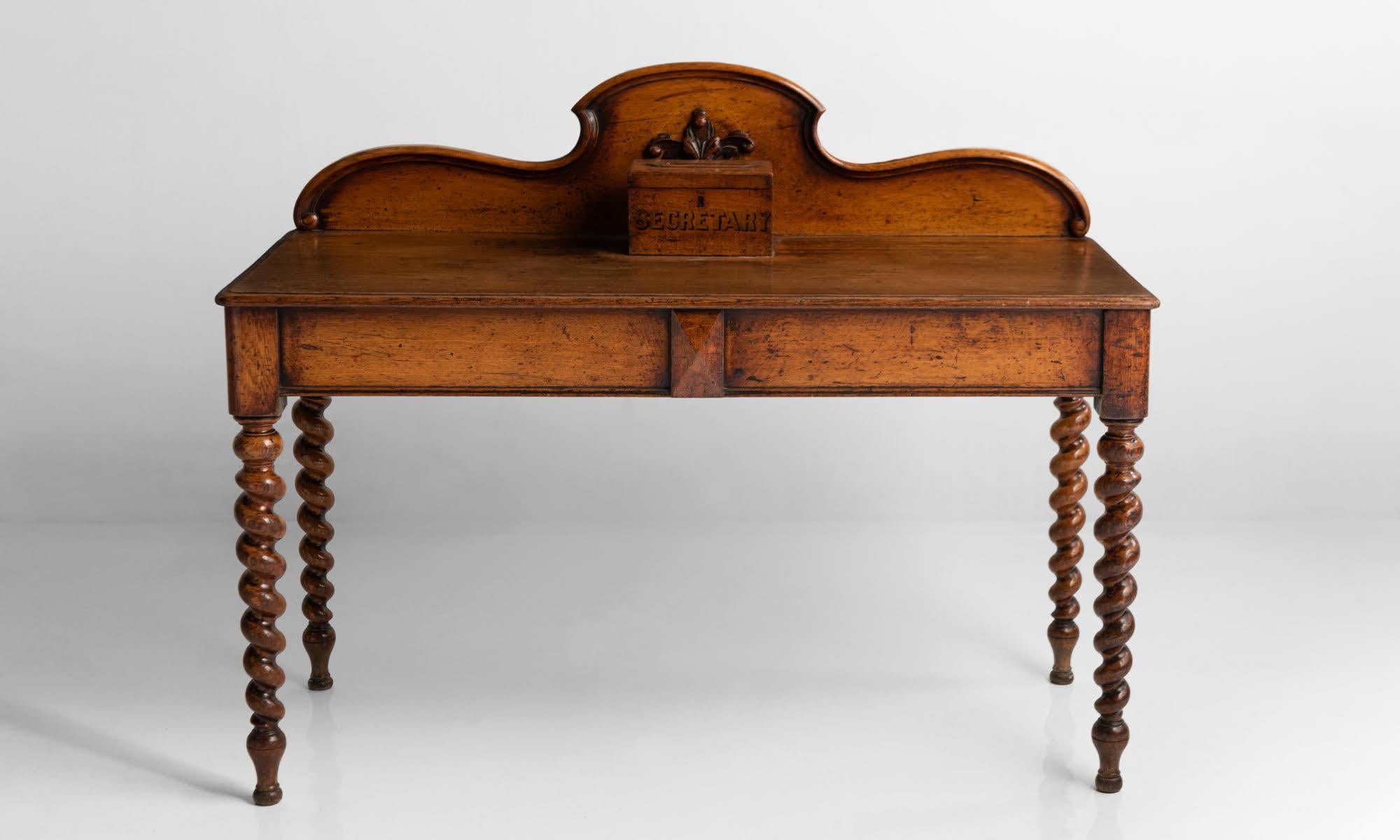Secretary hall table, England, circa 1900.

Oak hall table with hand carved spiral twist legs.

 