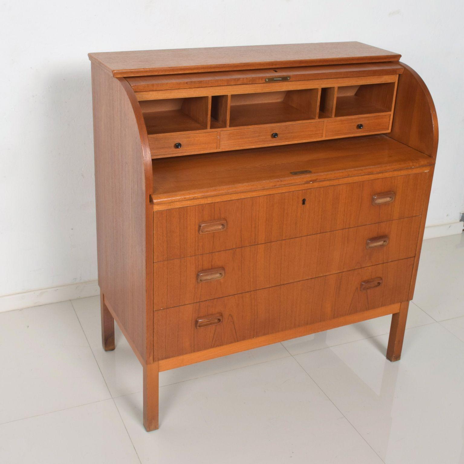 Swedish Modern Secretary Roll Top Desk in Teak Wood, 1960s 
Ample functional space- Ideal for home office. Clever concealed storage space. 
Attributed to Egon Ostergaard. No apparent label from maker.
Dimensions: 38