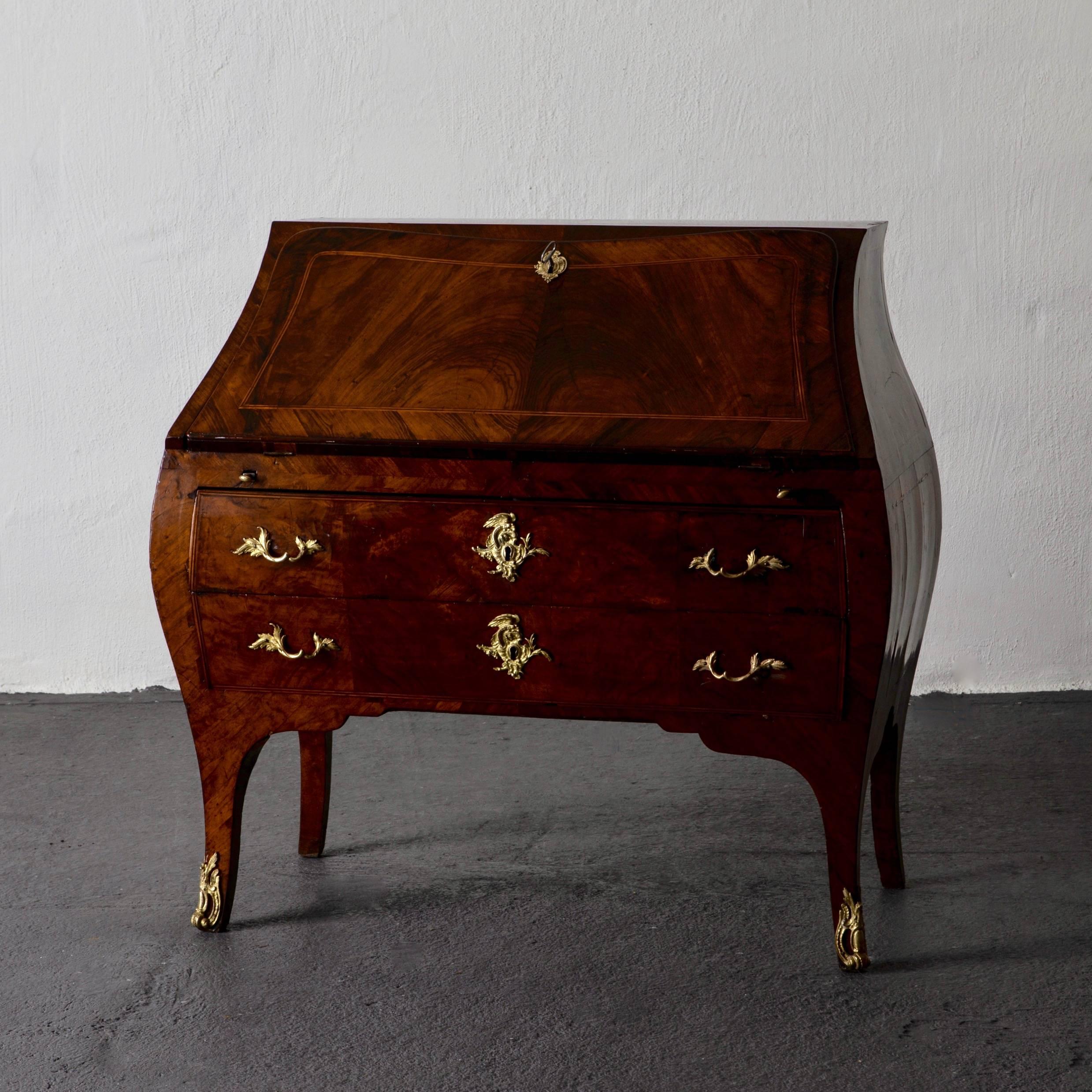 Secretary Writing Chest Swedish Rococo 18th Century Sweden. An exquisite secretary in a very high quality. Made in Sweden during the Rococo period 1750-1775 in a walnut veneer. Custom gilt bronze hardware and details in the shape of acanthus leaves,