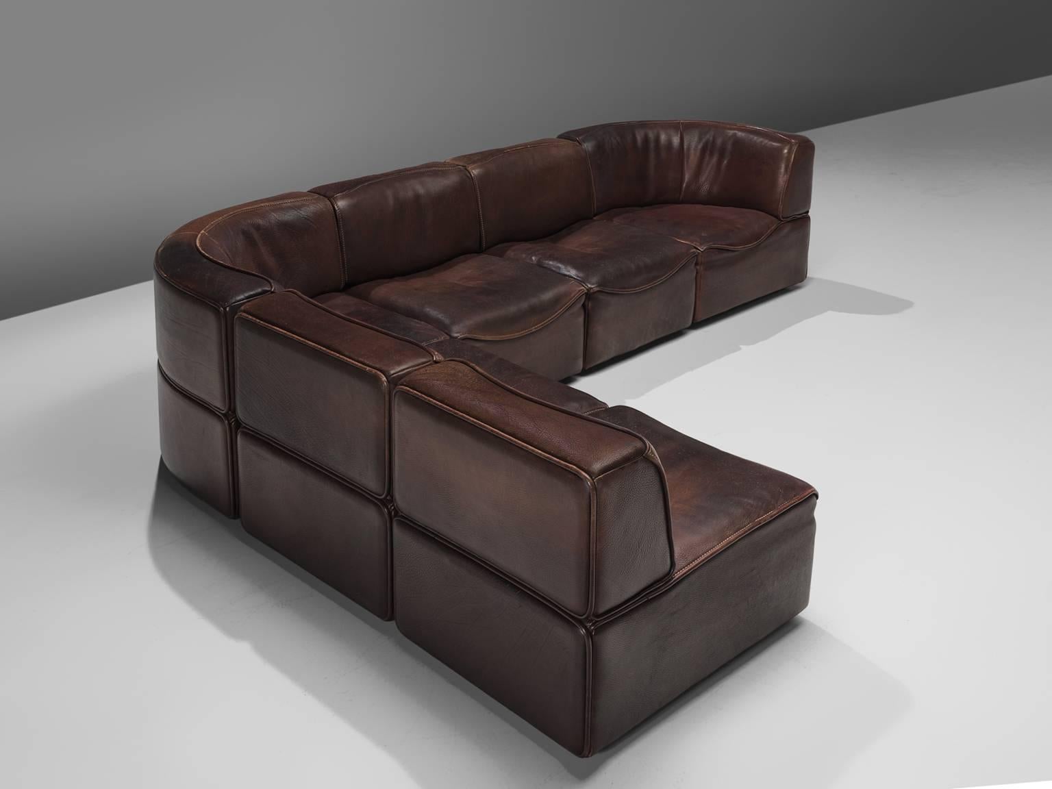 De Sede, sectional sofa model DS-15, six elements, in dark brown leather by Switzerland, 1970s. 

This sectional sofa contains two corner elements and four normal elements. The section make it possible to arrange this sofa to your own wishes. The
