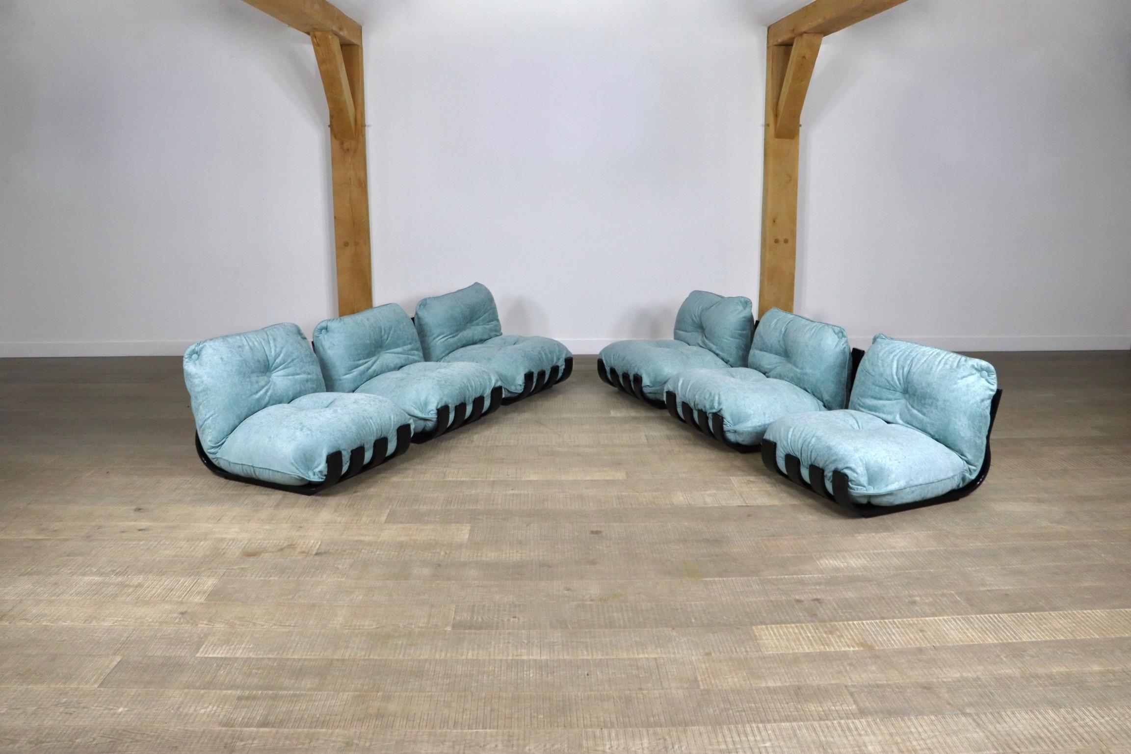 Incredible Gran Visir sectional sofa by Luciano Frigerio, Italy 1970s. The sculptural black laqcuered wooden frames complemented by newly upholstered blue velvet cushions in the most beautiful way. The outstanding comfort of the chunky cushions is