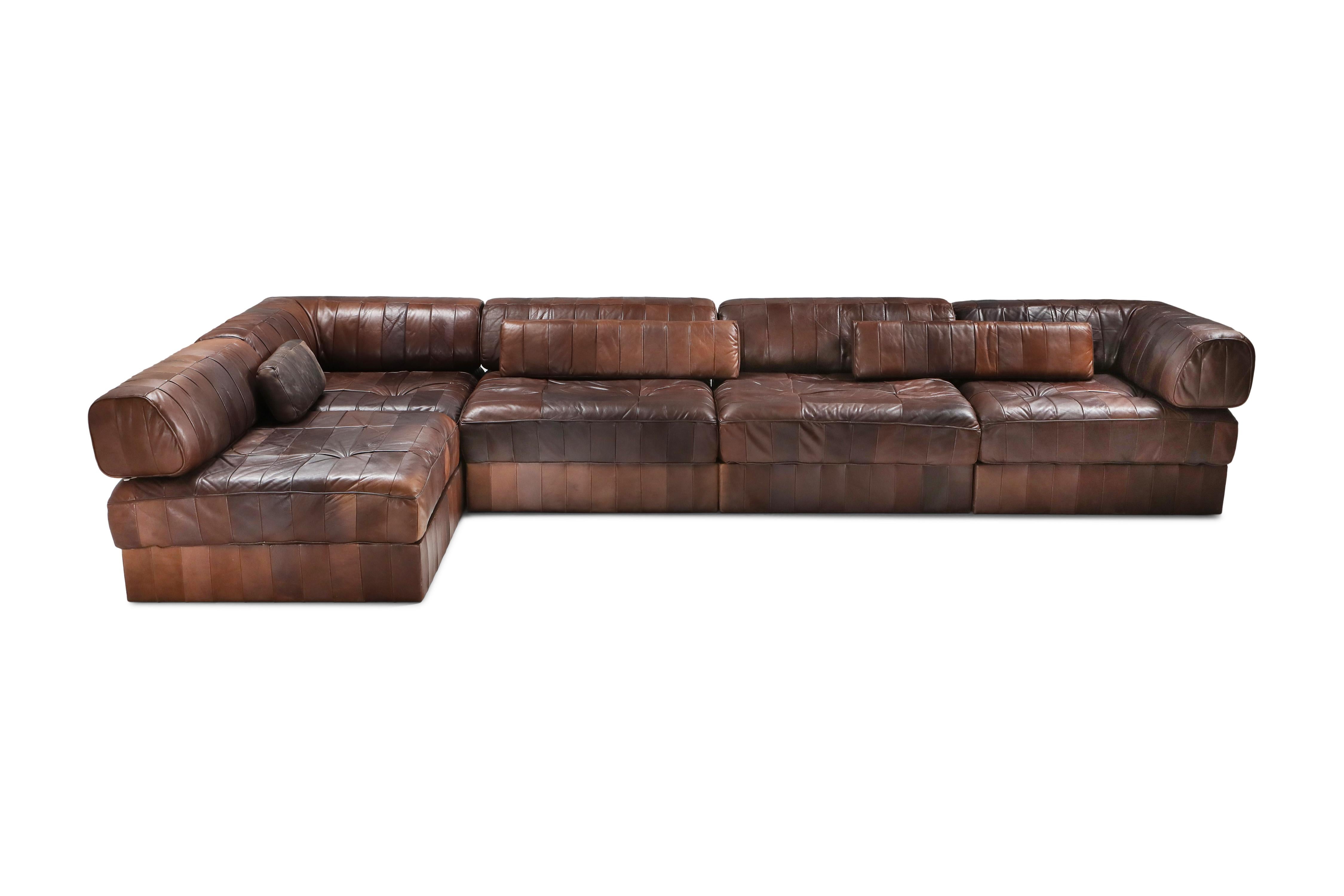 De Sede, modular sectional couch, DS-88, brown patchwork leather

Hand built in the 1970s to incredibly high standards by De Sede craftsman in Switzerland. Made of five sections, each with a base leather patchwork cushion and a back cushion made