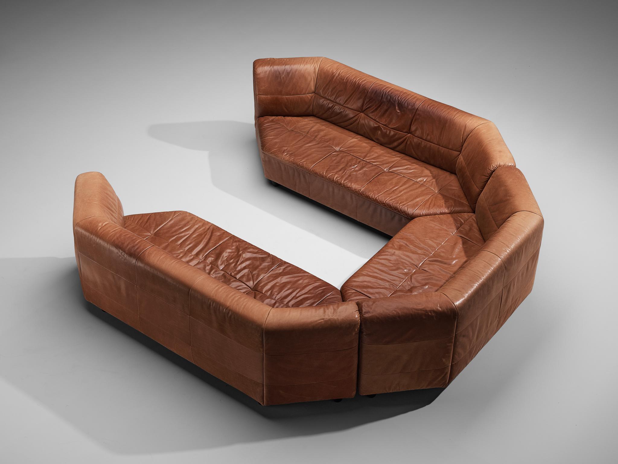Modular sofa, leather, wood, Europe, 1970s.

This well-designed sofa is executed in brown leather with patina that gives the sofa a lively and robust look. This sofa is characterized by a splendid construction consisting of three pieces in the shape