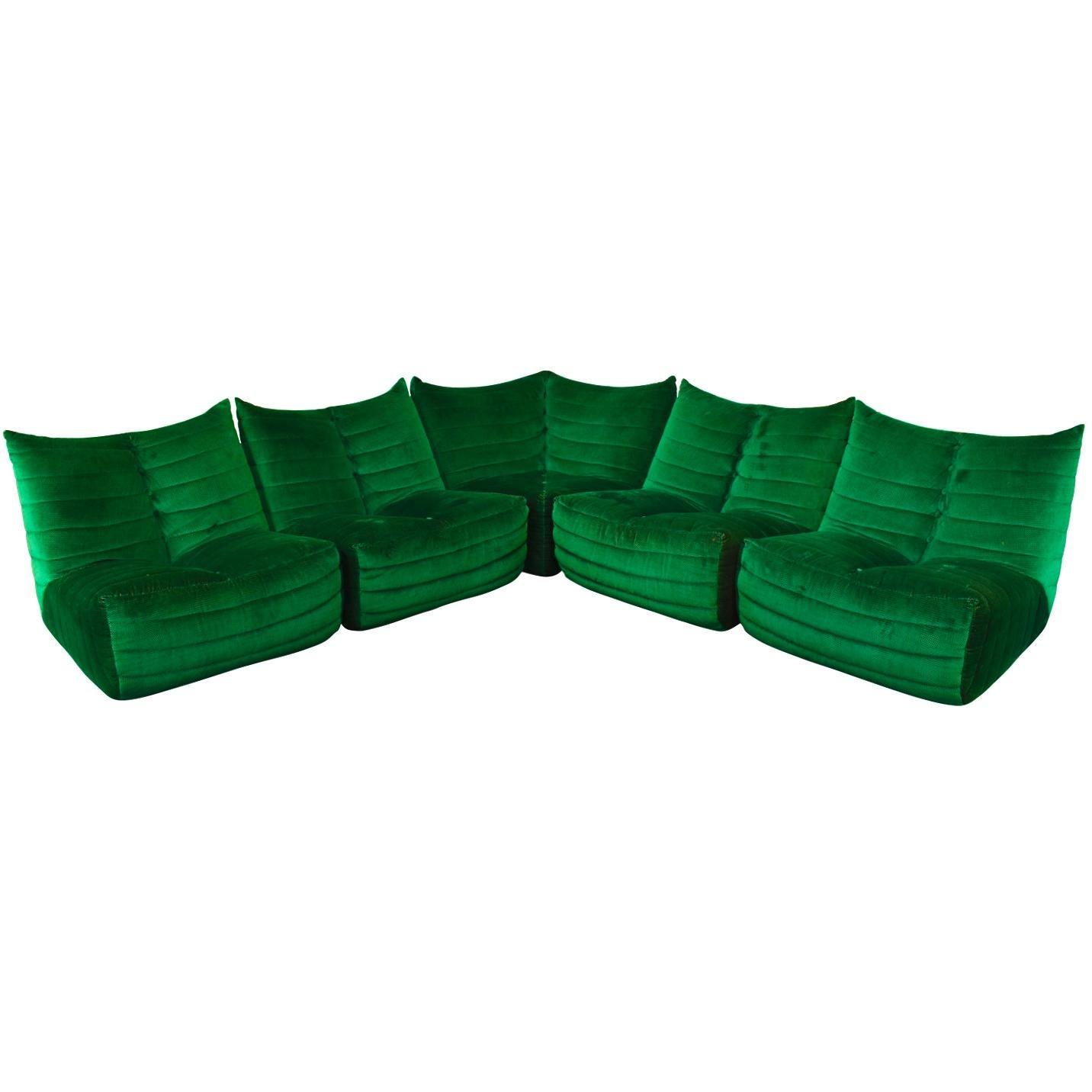 Amazing and very rare sectional sofa, model ZoZo, by Gianfranco Grignani for Seven Salotti Italy, circa 1970. 
This sofa is design in the manor of the Ligne Roset TOGO sofa but much rarer and more comfortable. The fabric is made of green velvet