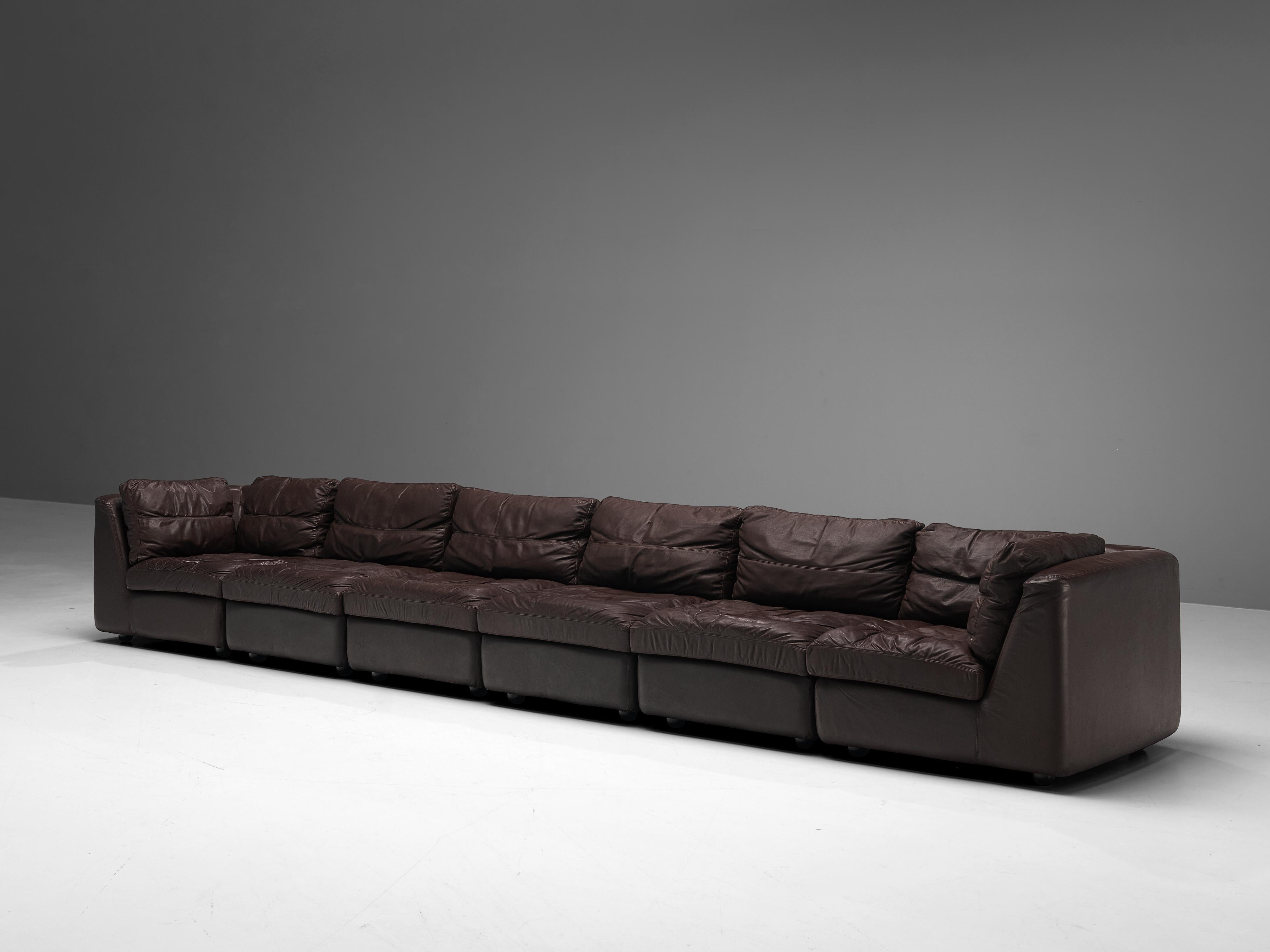 Sofa, patinated brown leather, Europe, 1970s

This comfortable leather sofa is made in high quality. The sofa features four seats and two corners, making it very versatile to create a composition to your own liking. The cushions are upholstered