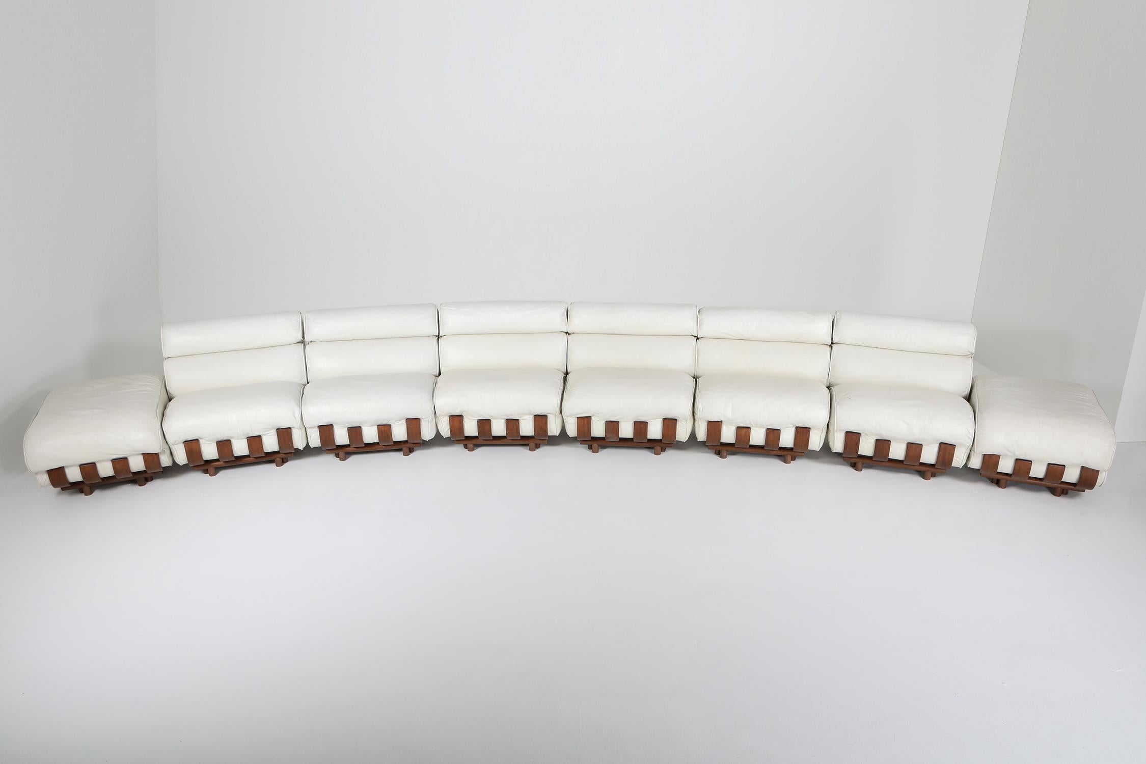 Luciano Frigerio, sectional couch, Postmodern, Italy 1980s

Luxury leather piece, big and comfy seating mounted on a super nice walnut frame.
The frame reminds a bit of the costela chairs
The entire sectional consists out of 6 lounge chairs and
