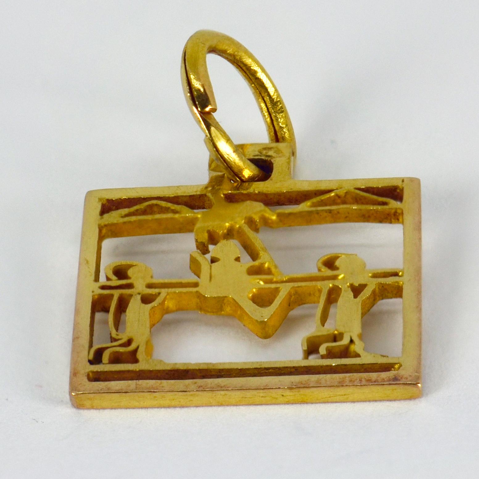 An 18 karat (18K)  yellow gold square charm pendant designed as a sedan chair and its bearers. Unmarked but tested as at least 18 karat gold.

Dimensions: 1.8 x 1.5 x 0.1 cm (not including jump ring)
Weight: 1.68 grams

