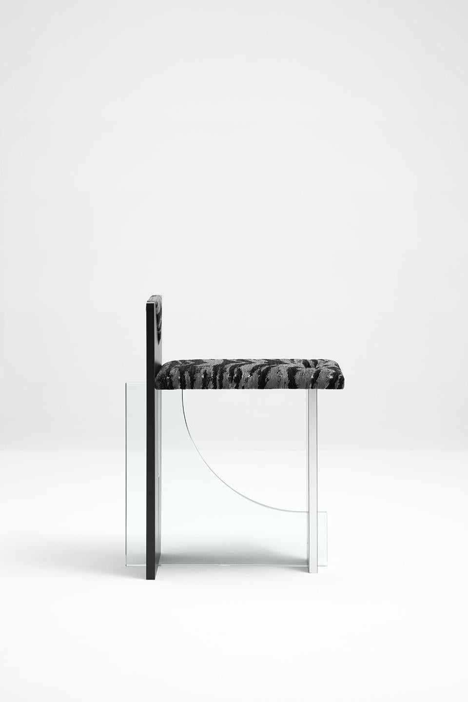 Chair with structure in glass and wood laminated in brushed steel and matte black. Upholstered in tiger silver fabric and polished steel detailing on the backrest.
Dimoremilano, by designer Dimorestudio
Code: Sedia135
22% VAT WILL BE ADDED ON