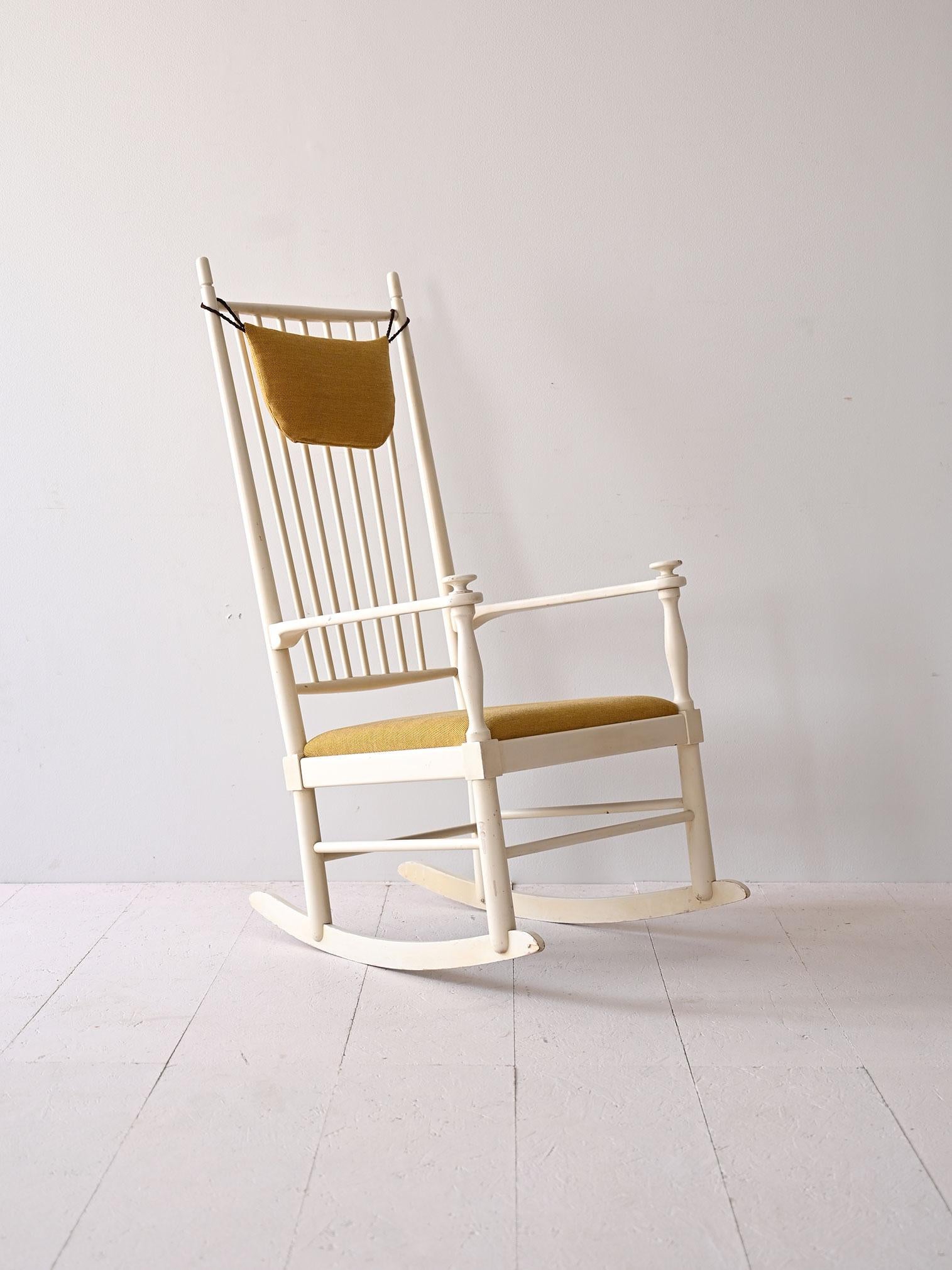 The Gemla model rocking chair is an icon of Scandinavian design. A piece that combines elegance and comfort with its wooden frame, typical of Swedish quality craftsmanship. The design features simple yet refined lines, with a wide backrest with
