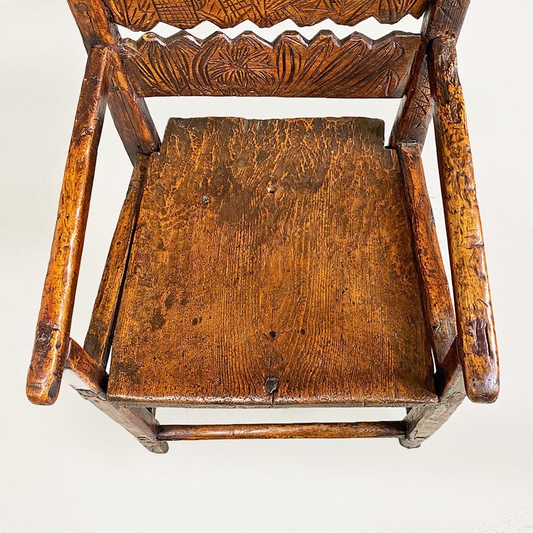 Early 19th Century Italian antique chair with high backrest and carved wooden armrests, 1800s For Sale